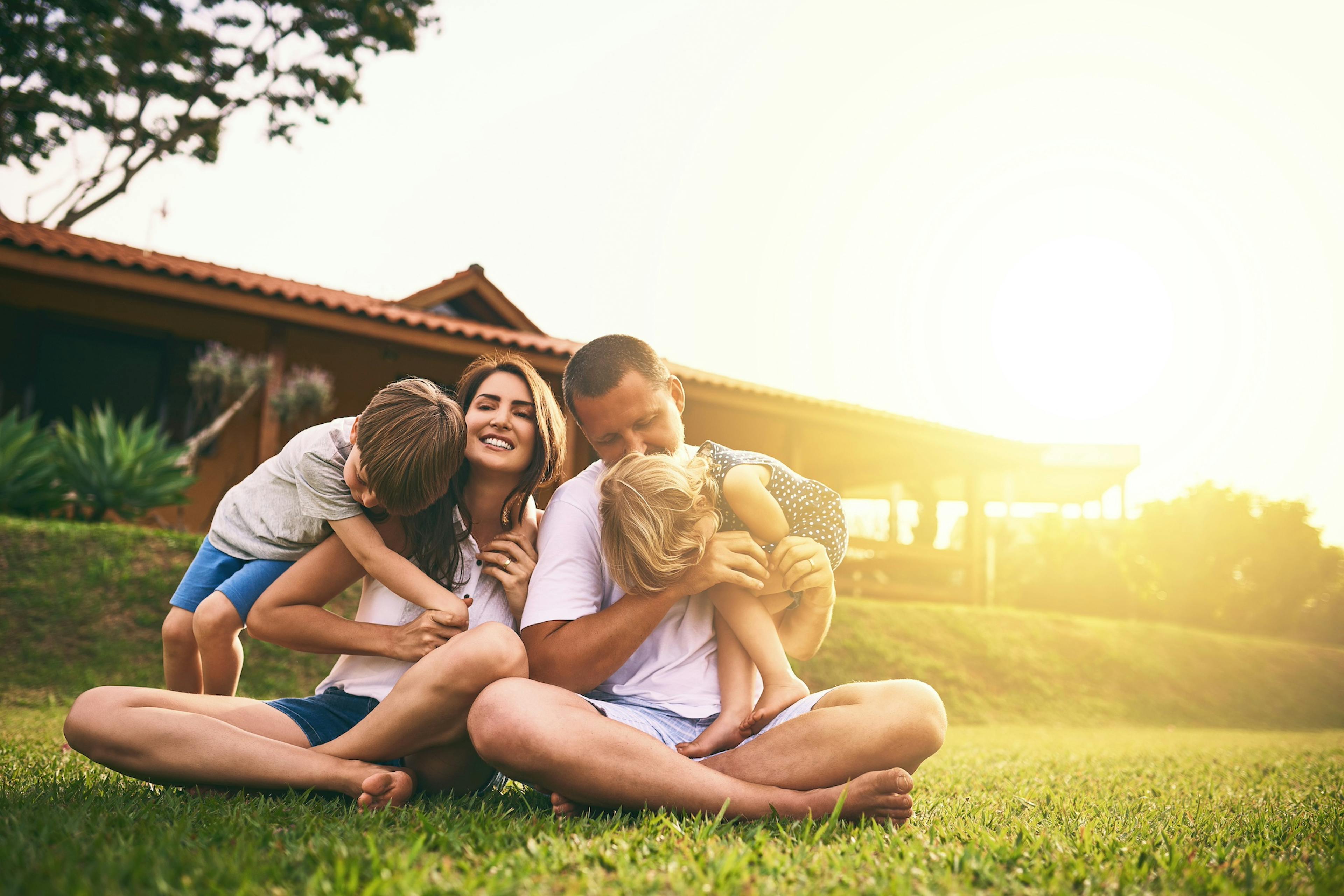 happy family outside in the setting sun