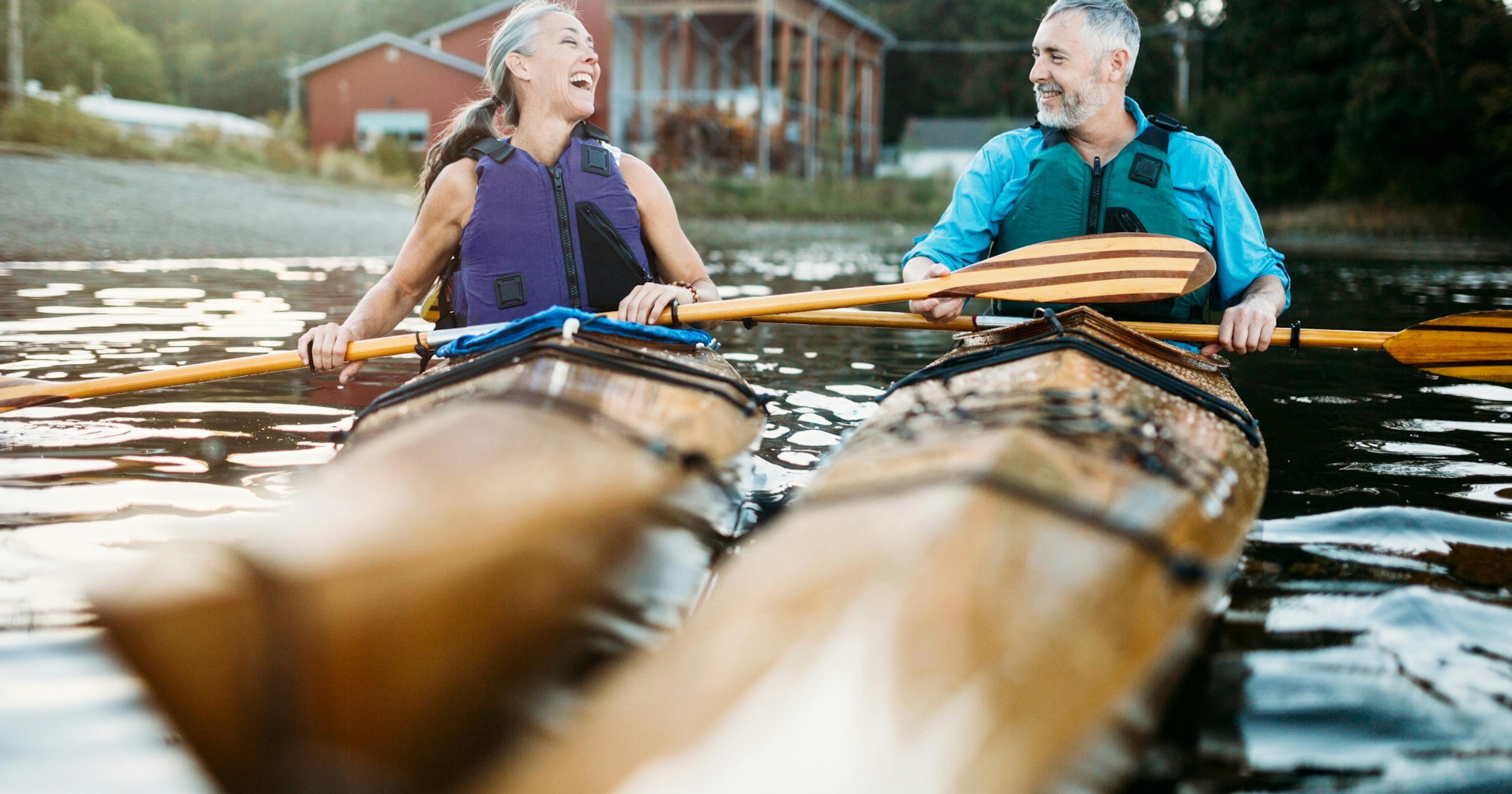 Mature couple having fun kayaking.