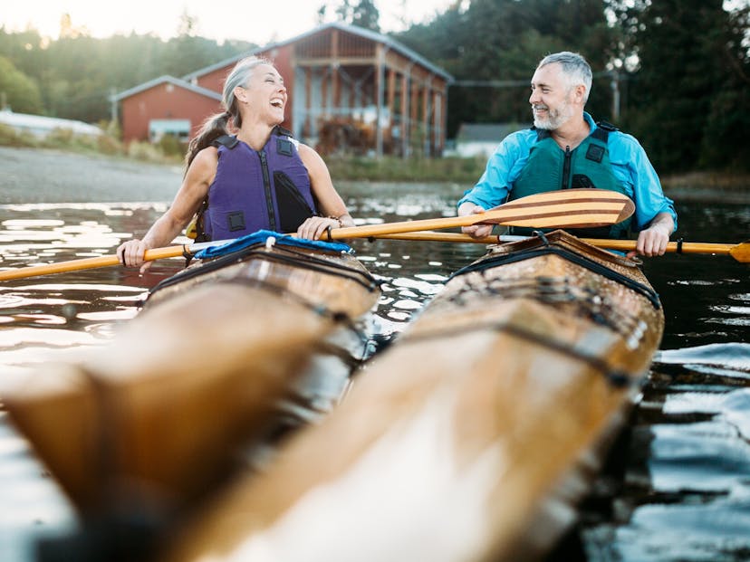 Mature couple having fun kayaking.