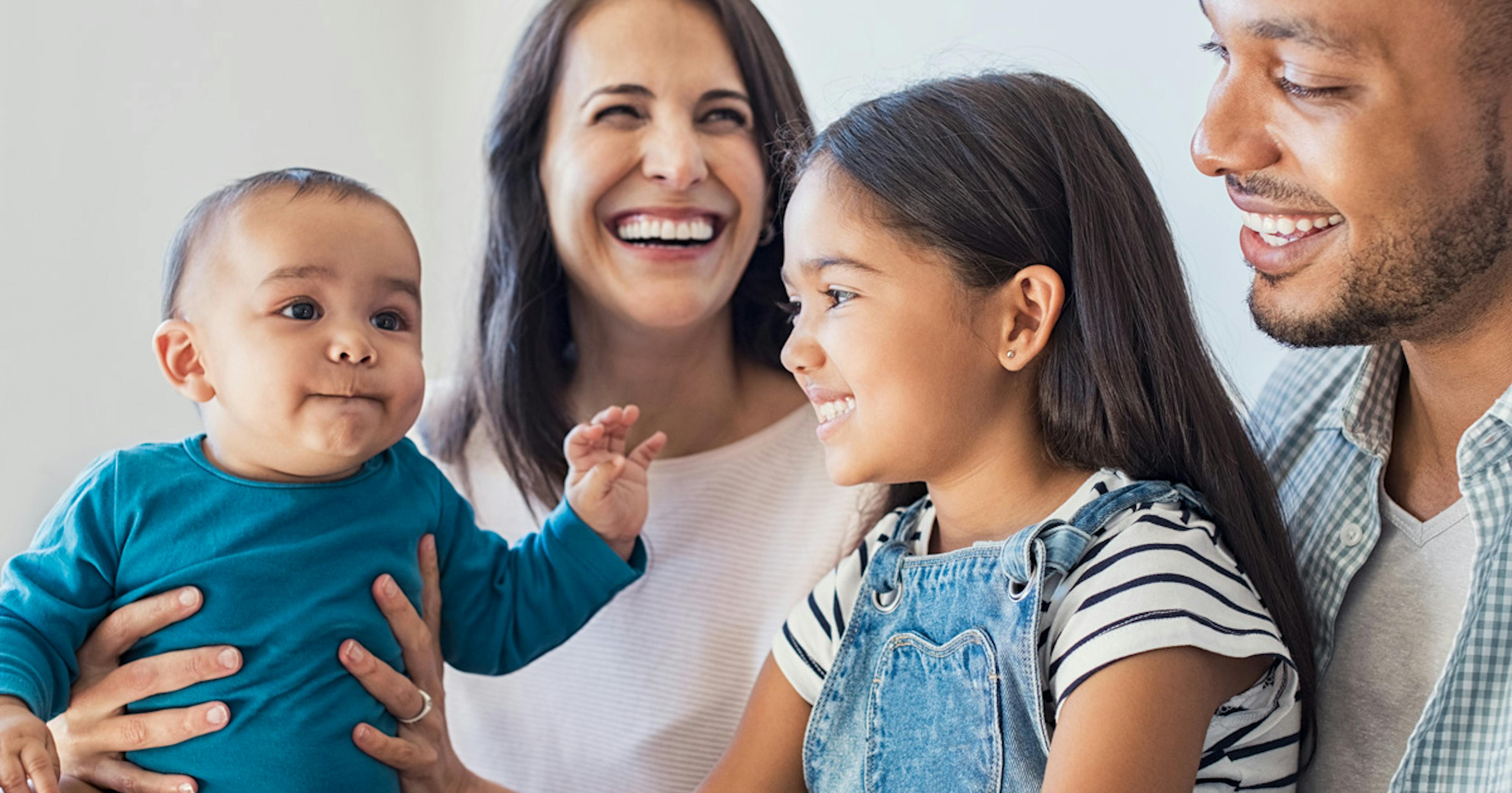 Family of four having fun together.