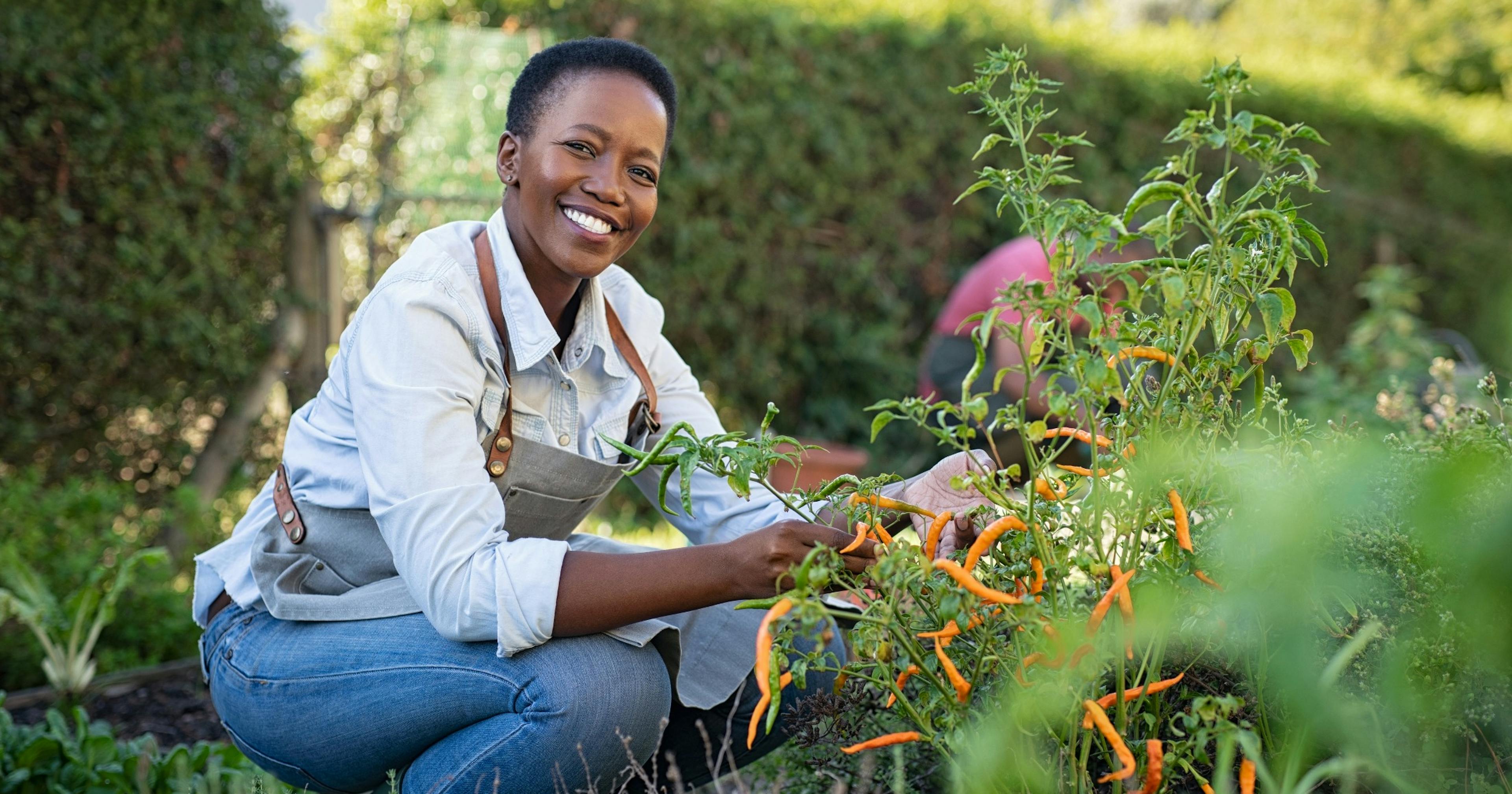 happy middle-aged woman working in the garden