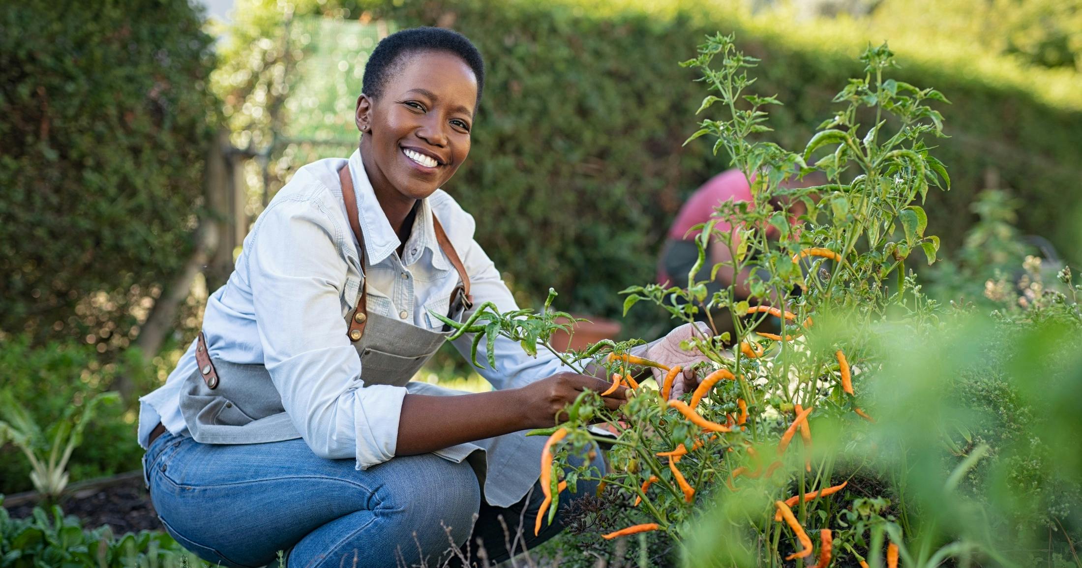 happy middle-aged woman working in the garden