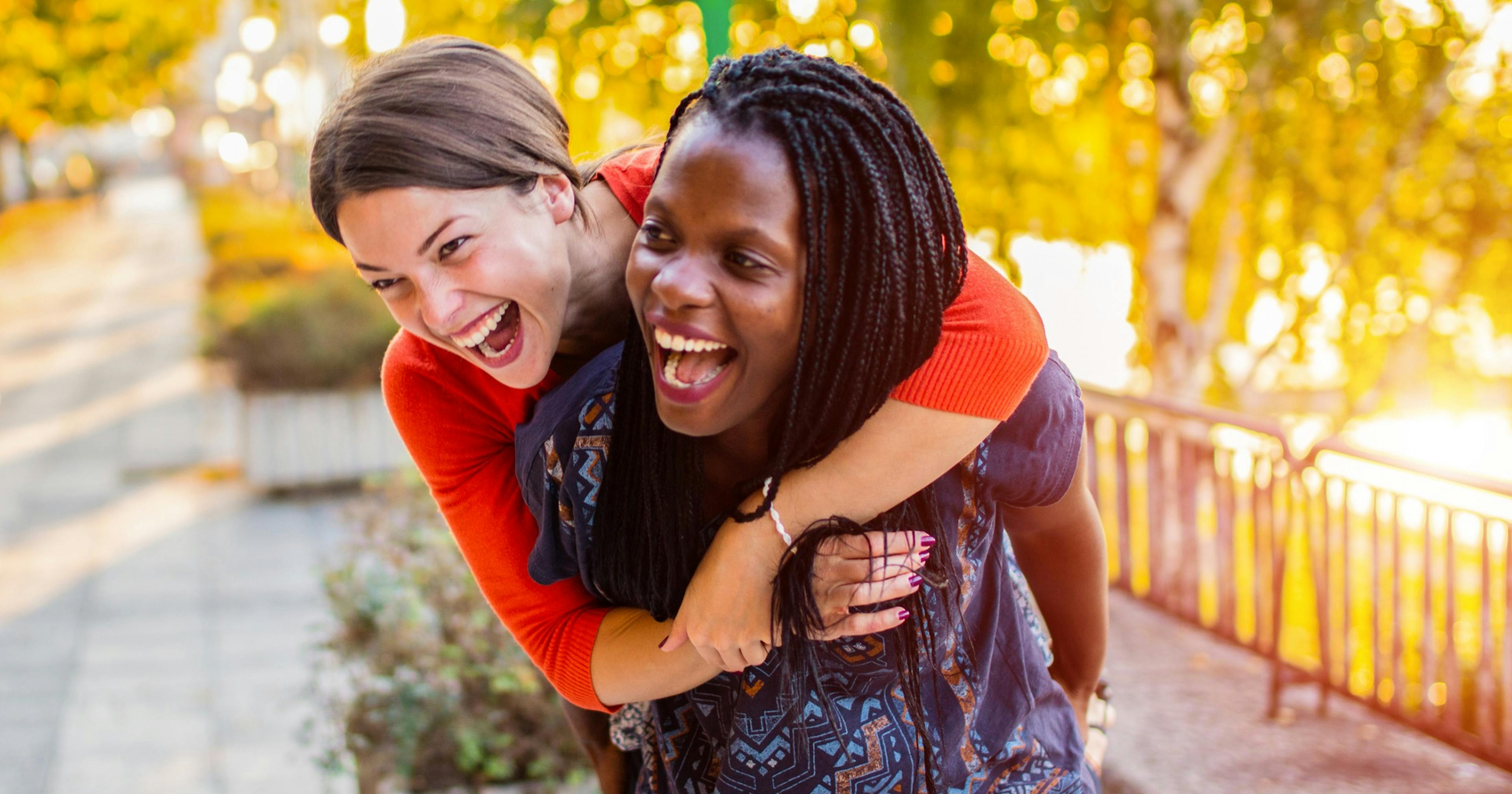 happy woman outside laughing together