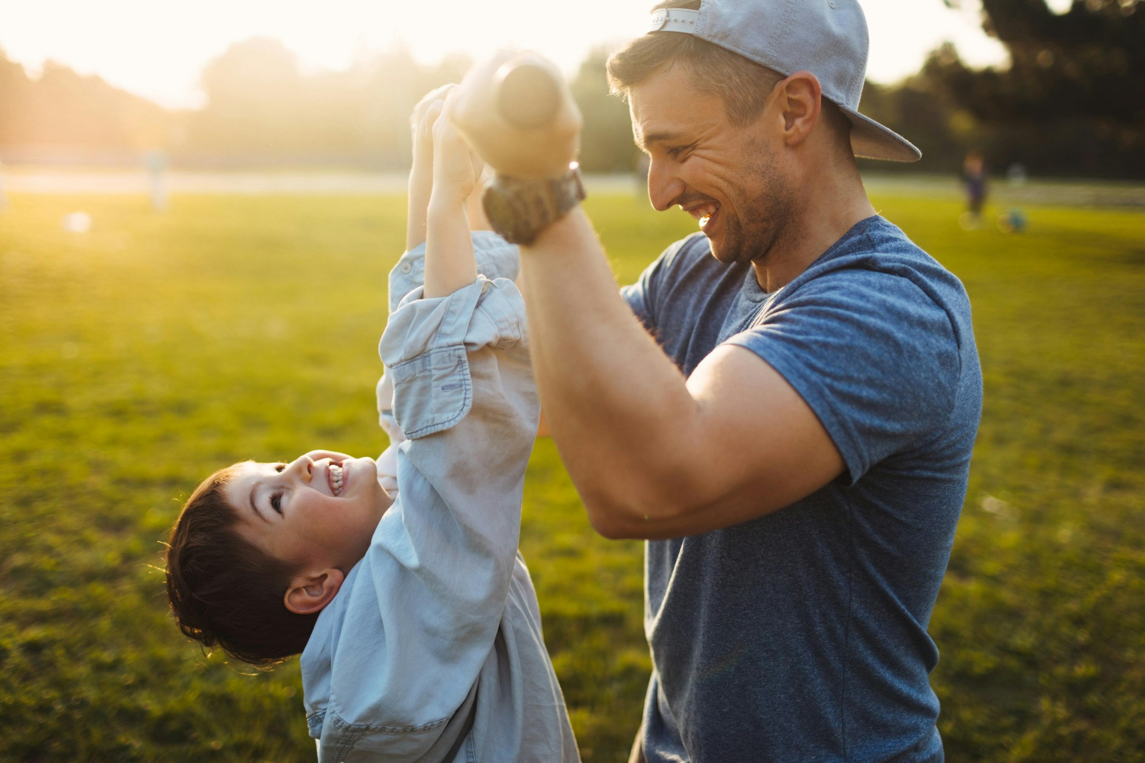 father and son having fun outside together