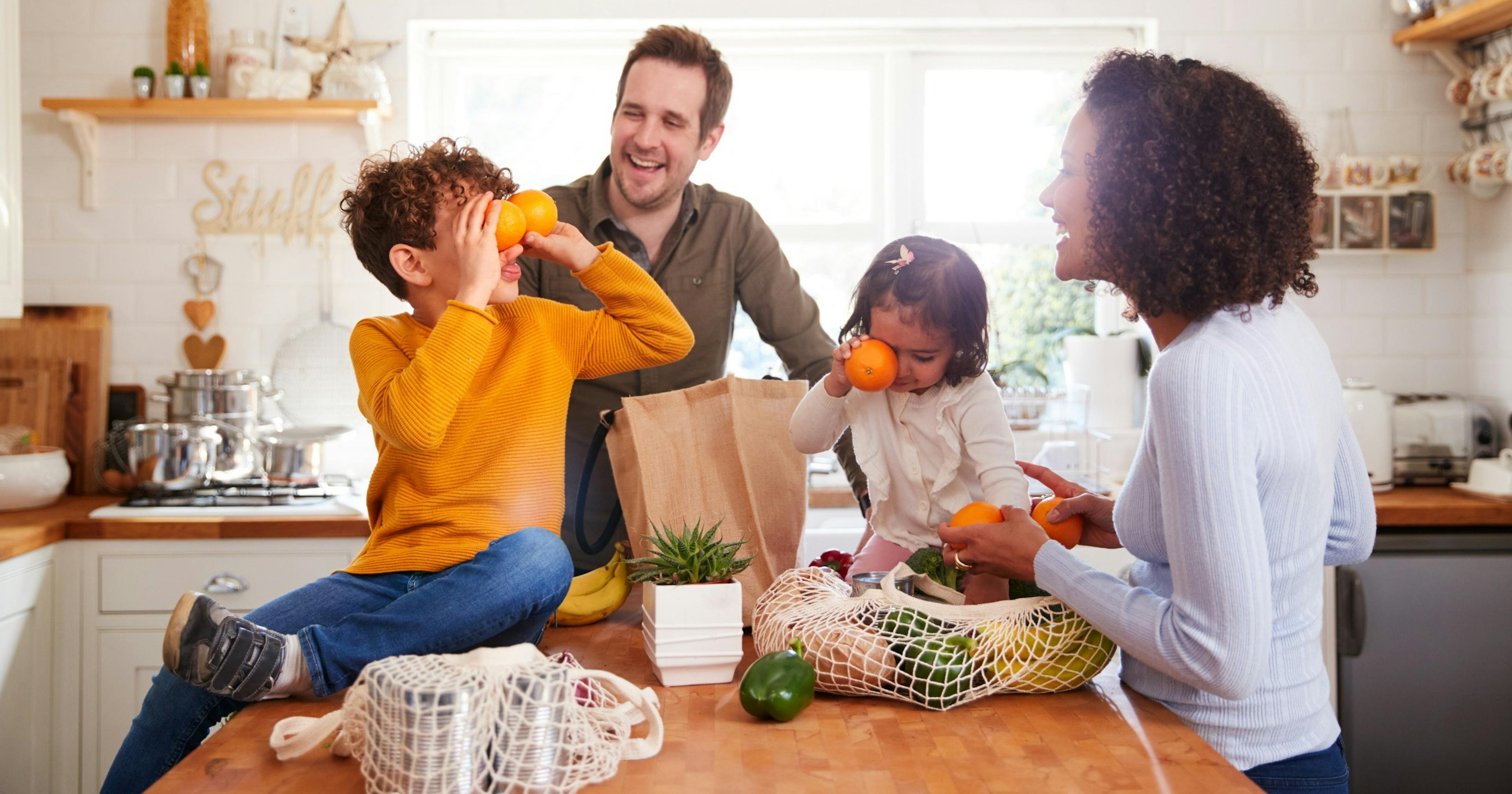 Family coming home after a trip to the grocery store.
