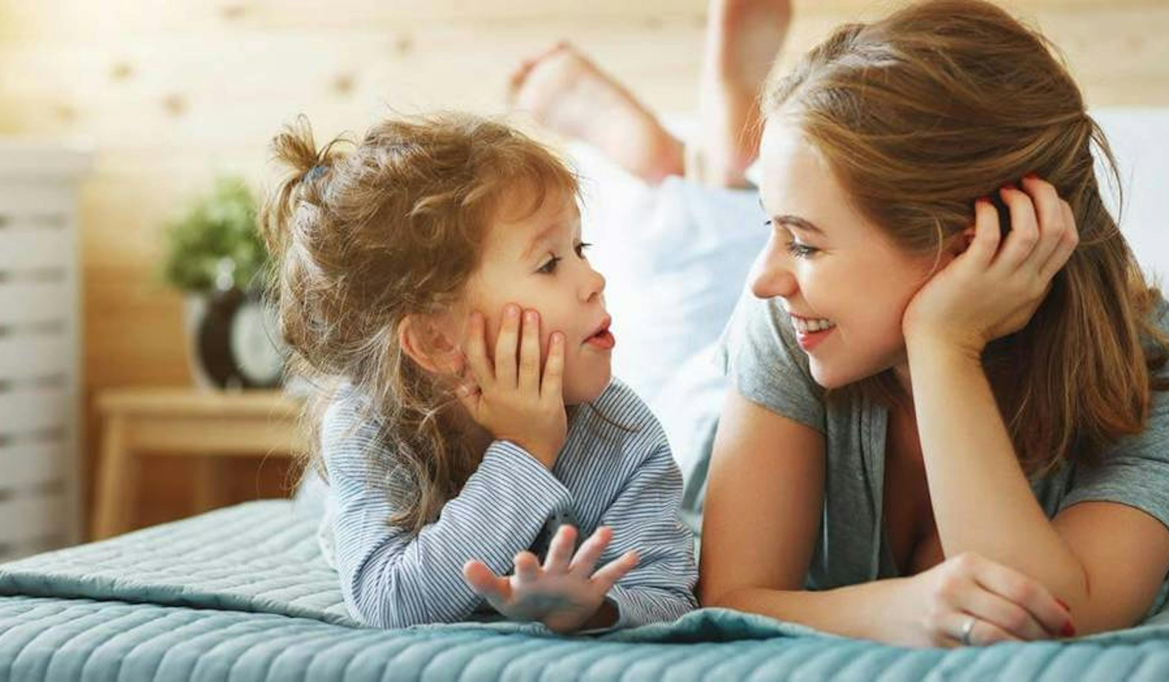 happy mom and daughter at home