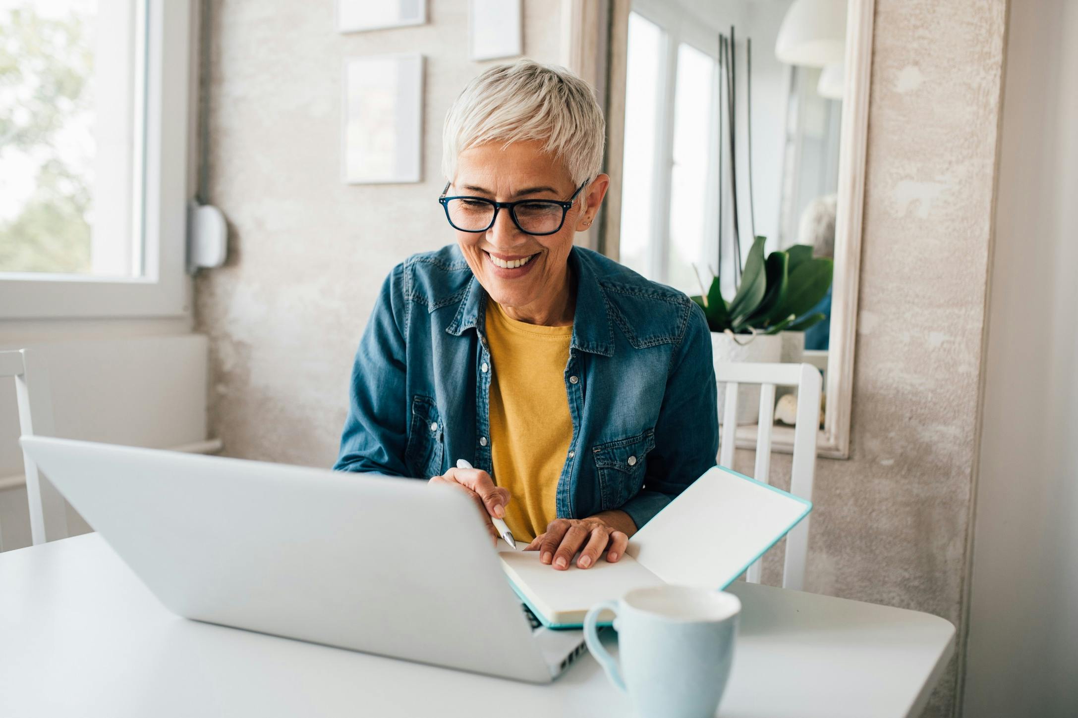 mature woman talking to her doctor virtually.