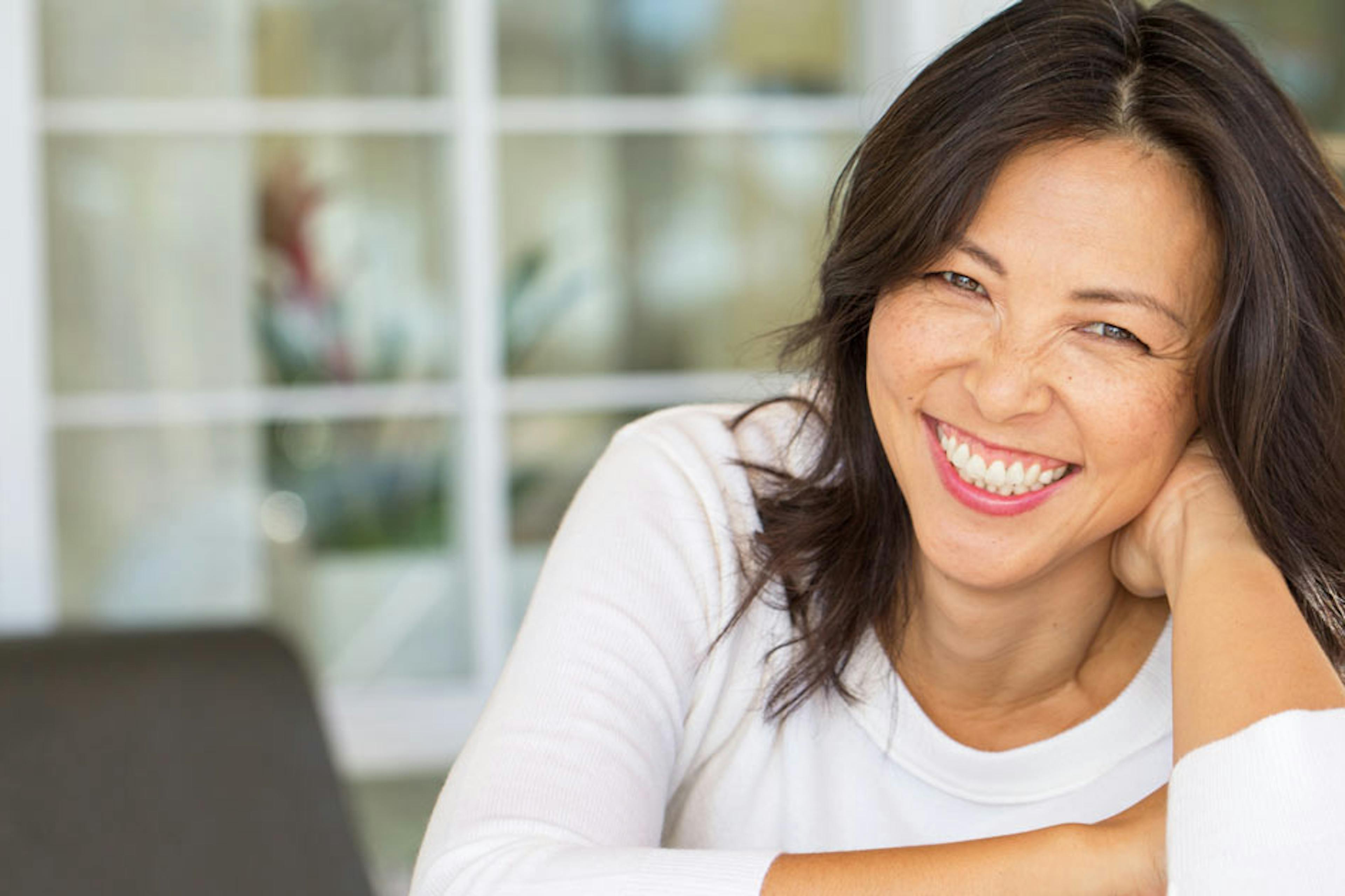 woman sitting and smiling