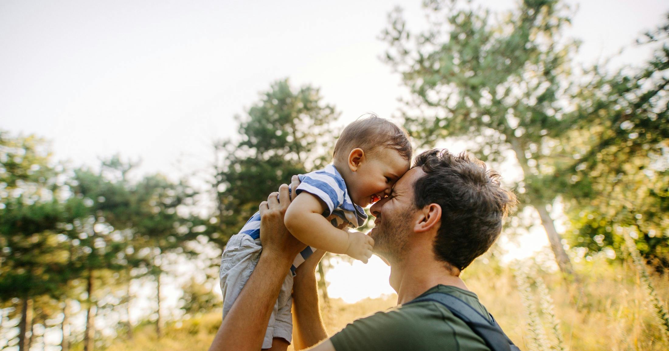 baby boy with dad in nature