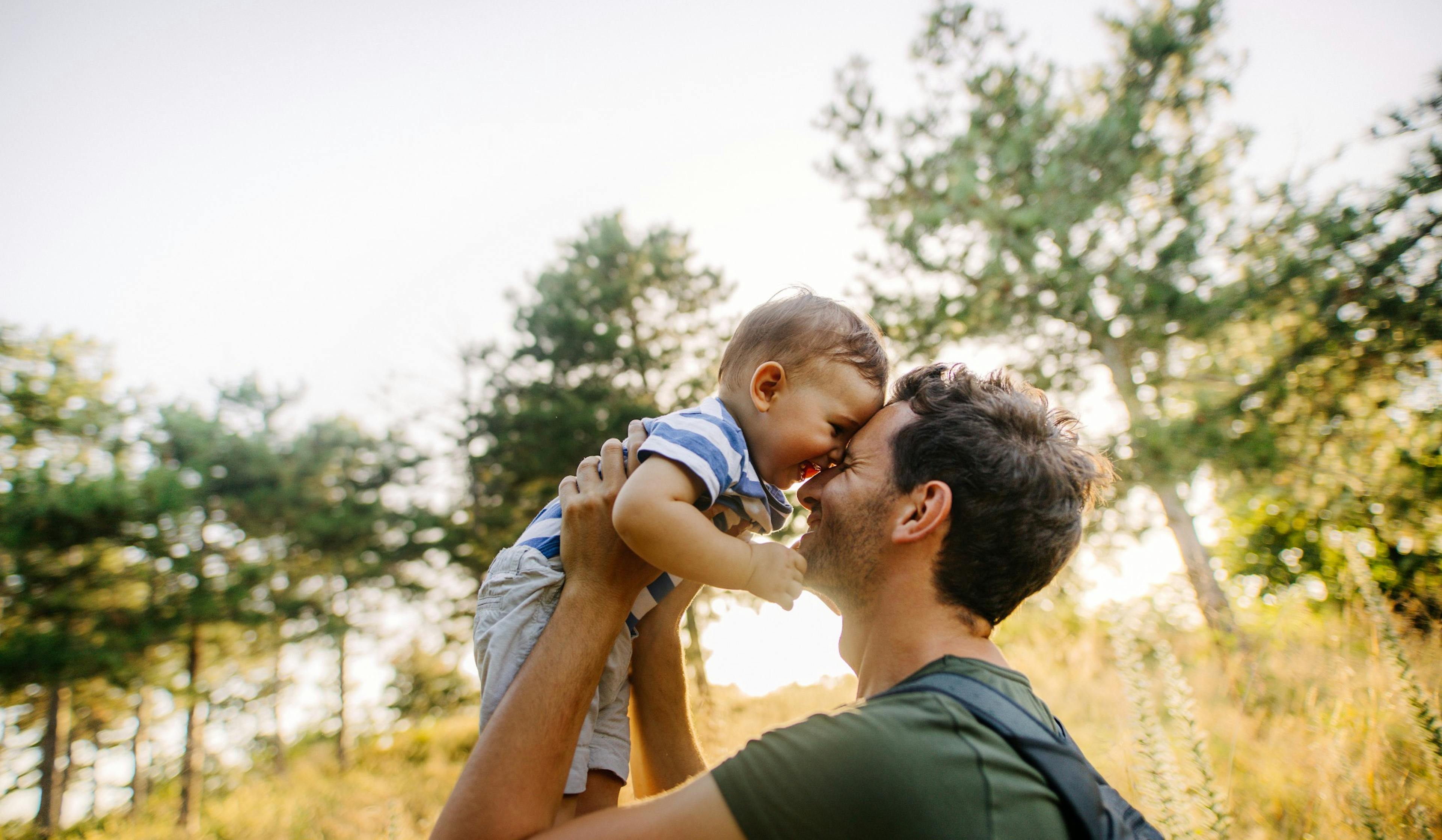 baby boy with dad in nature