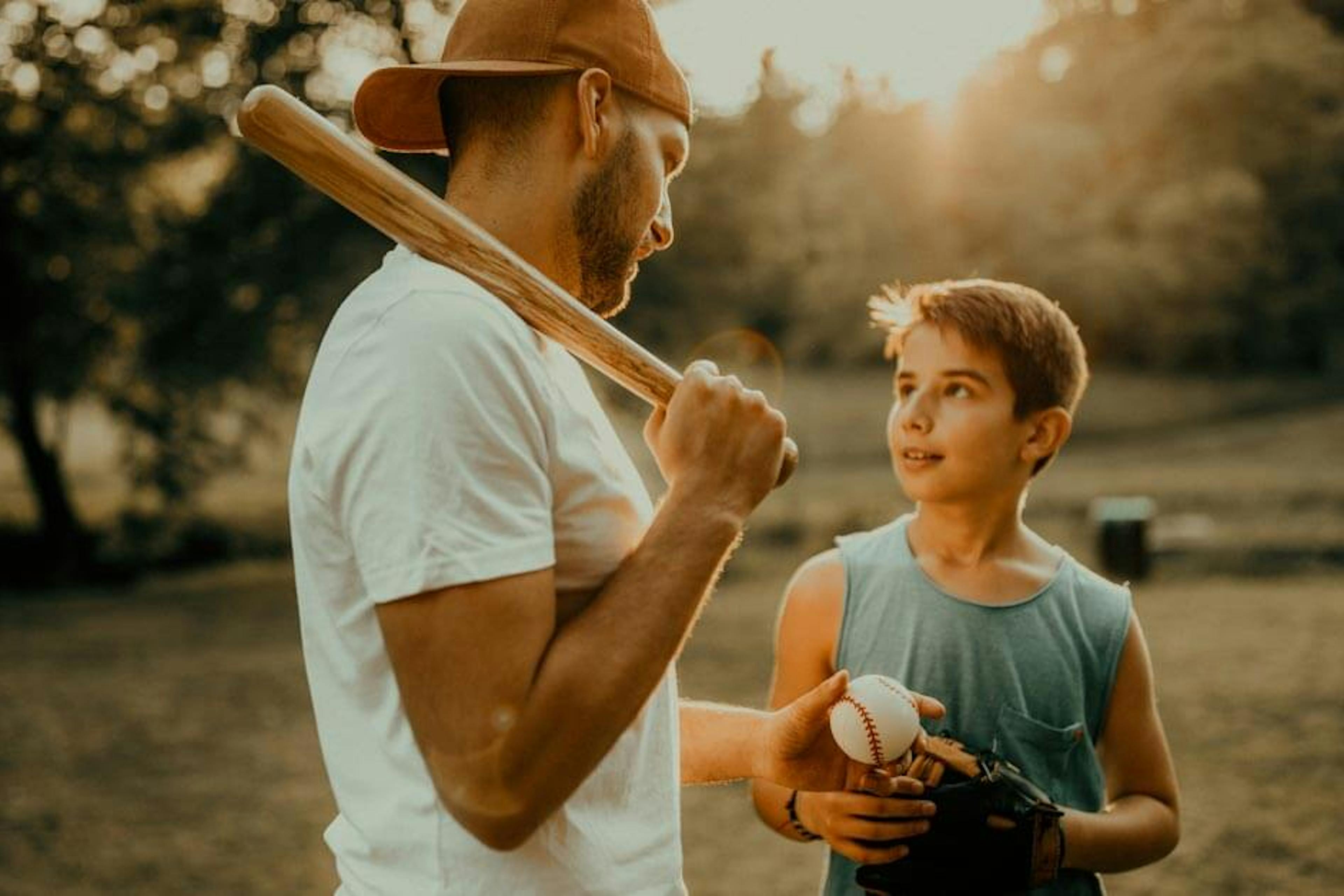 dad and son playing baseball