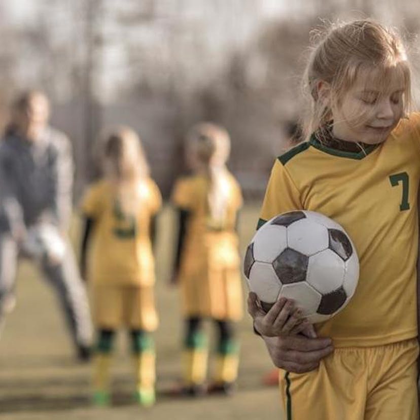 dad and daughter at soccer practice