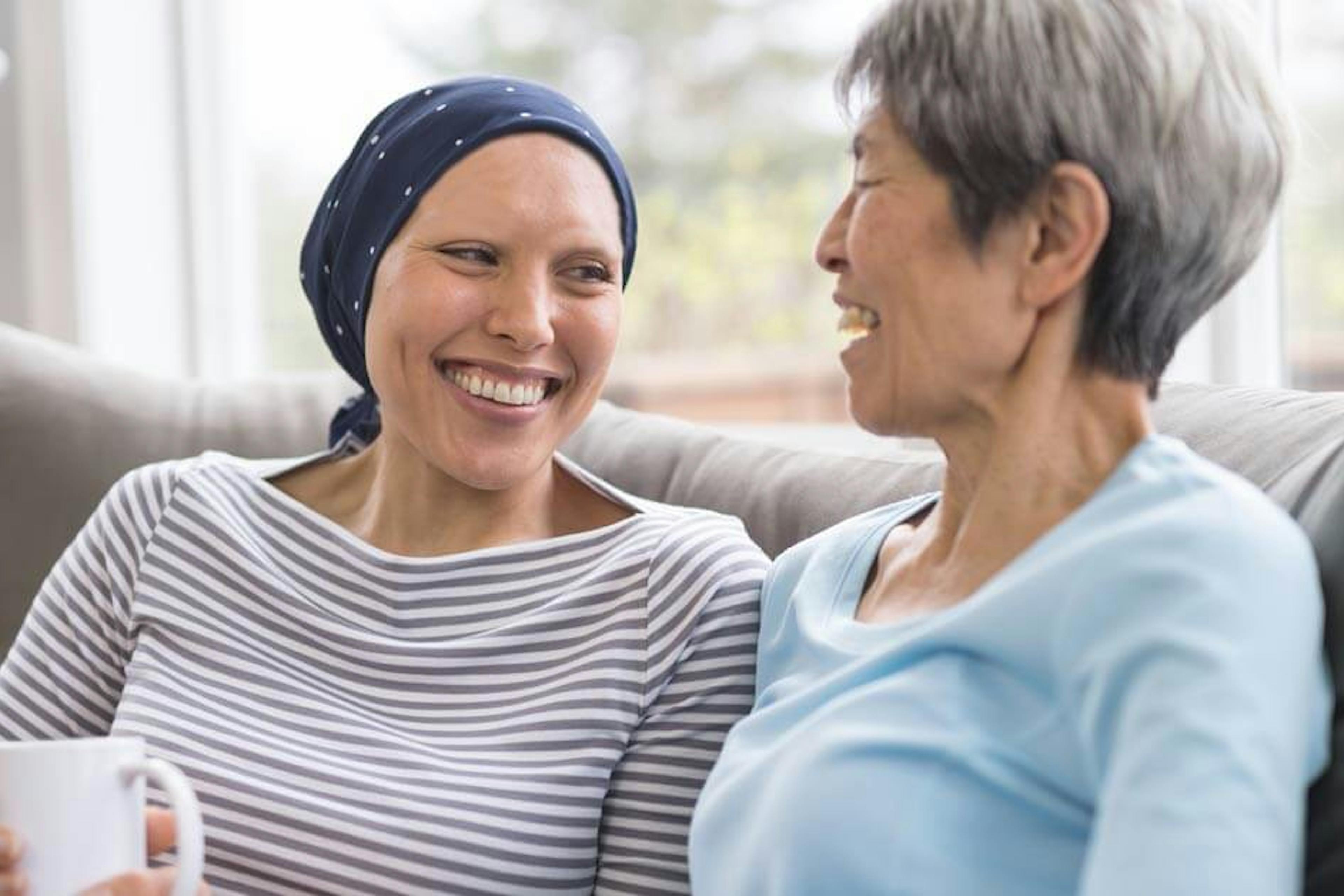 woman with cancer talking to a friend