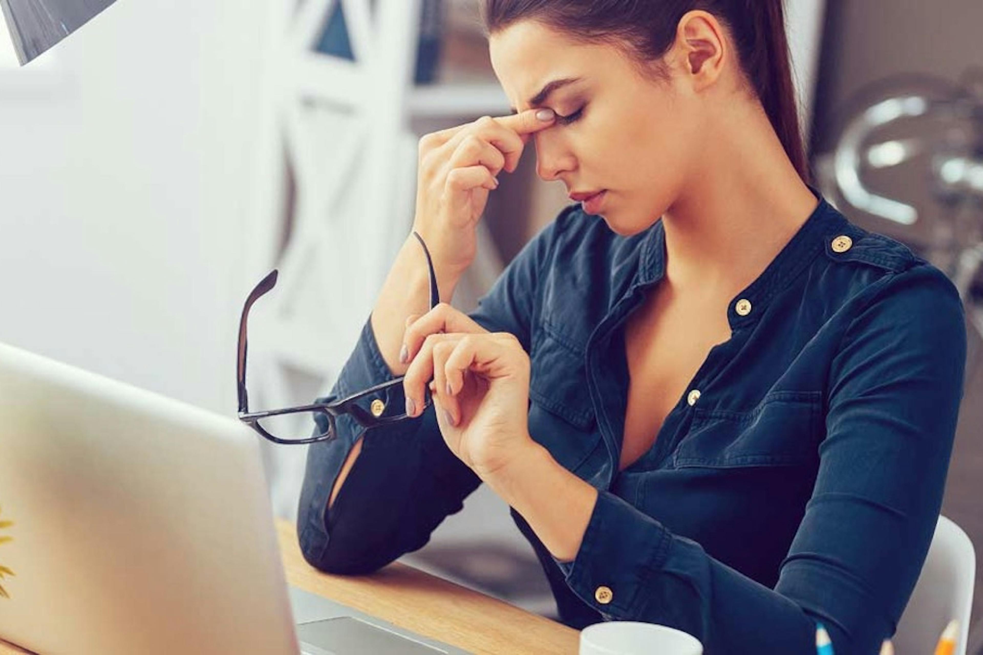 a tired woman at work