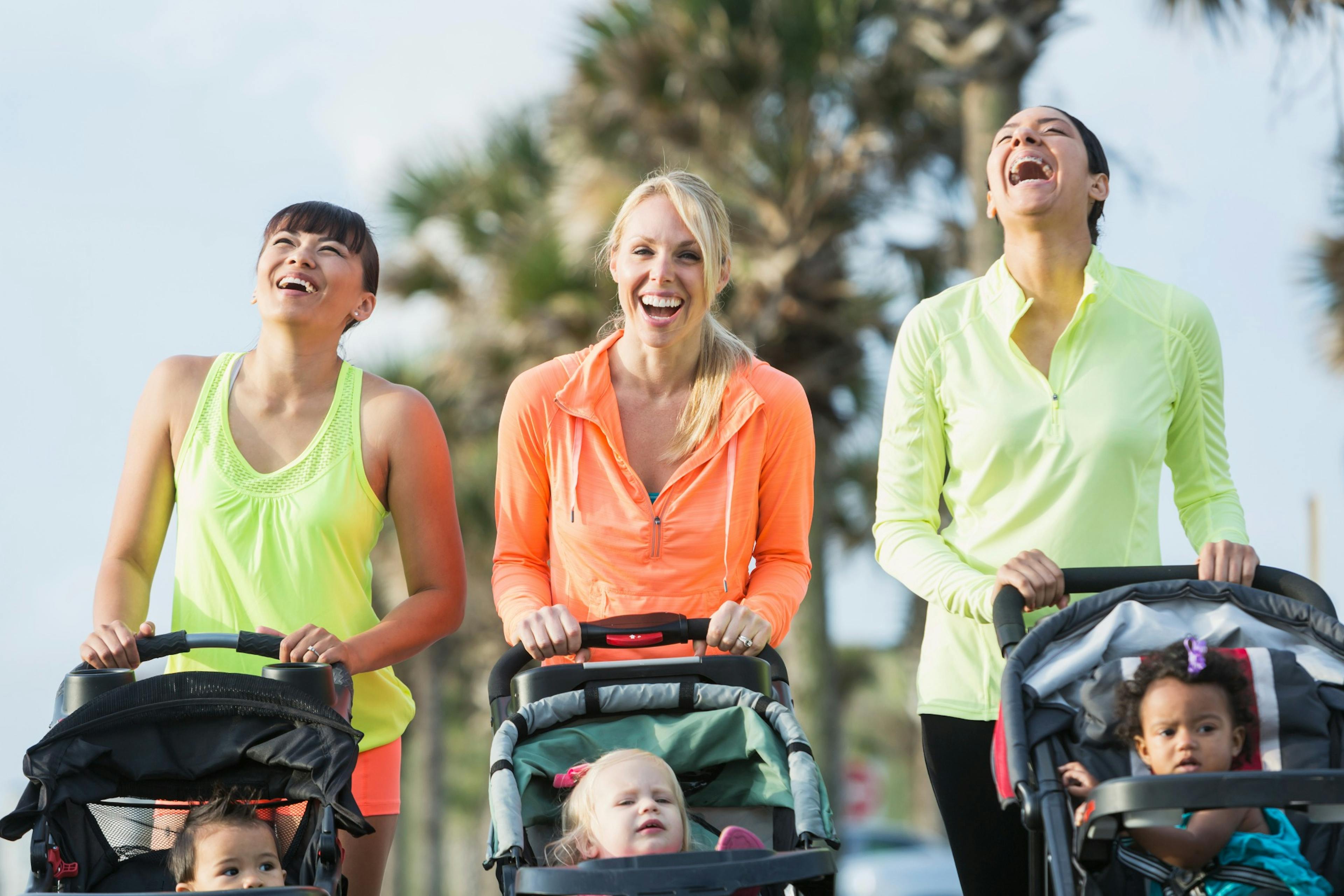 moms walking with babies in strollers