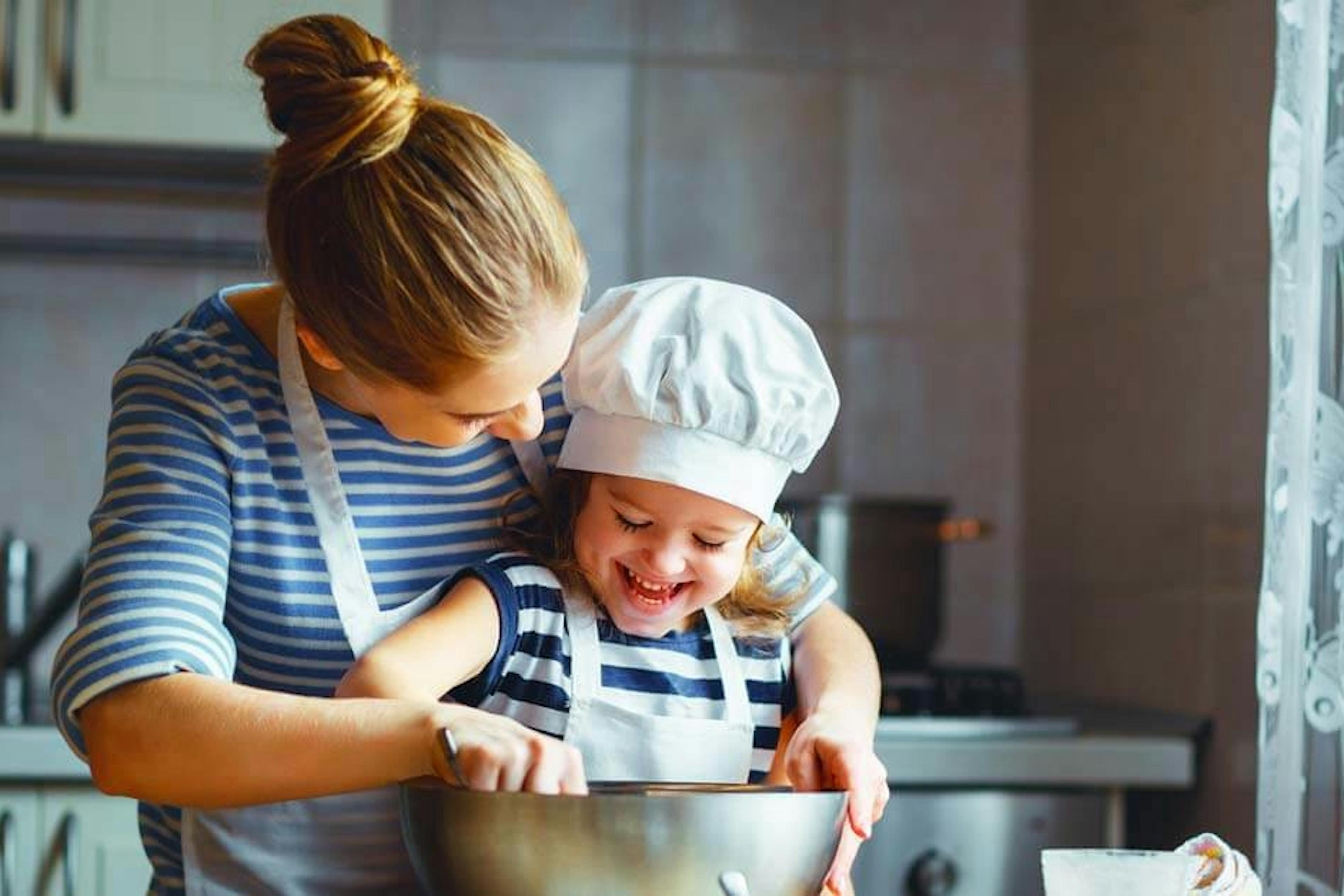 mom and daughter cooking