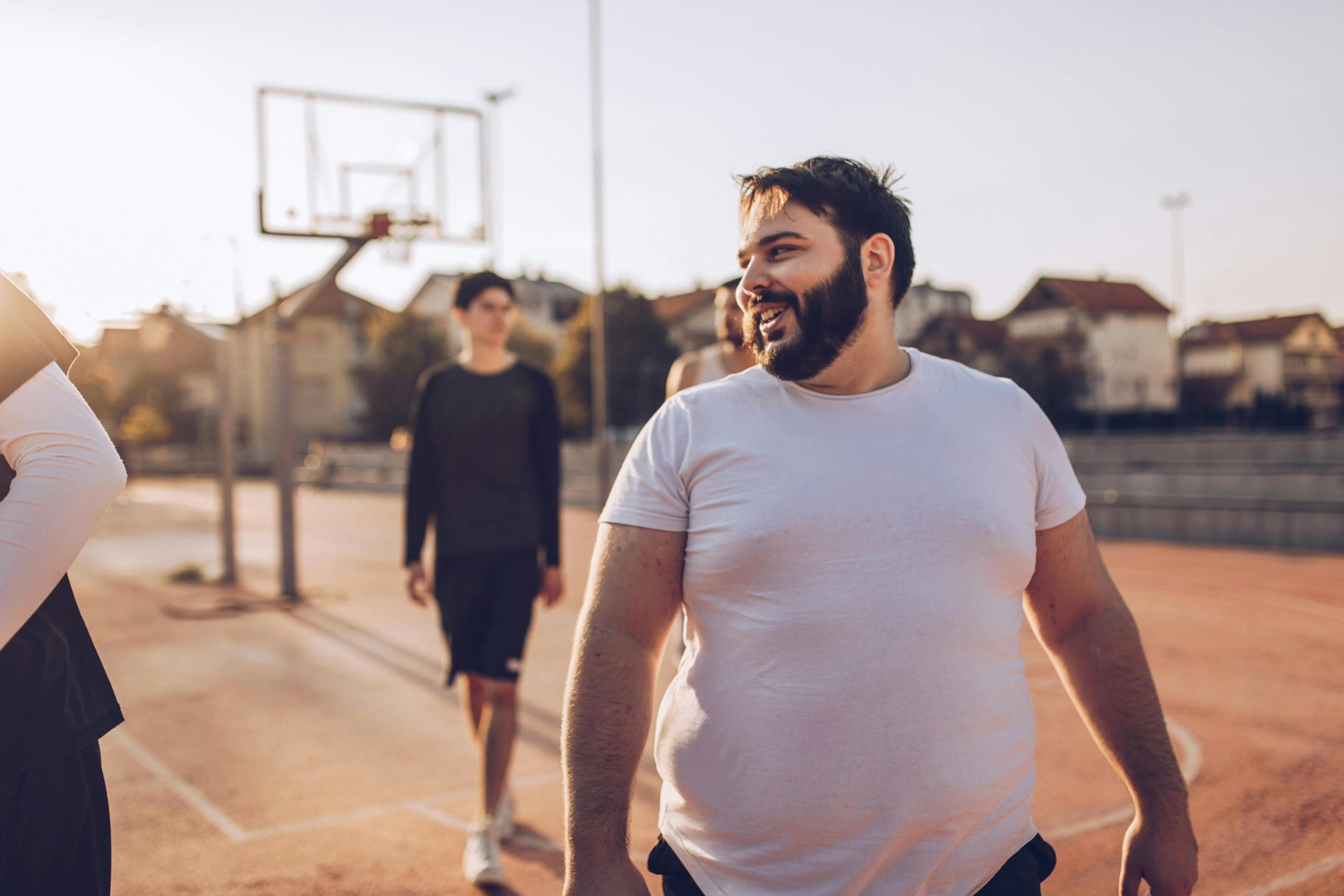 overweight man after a pickup basketball game