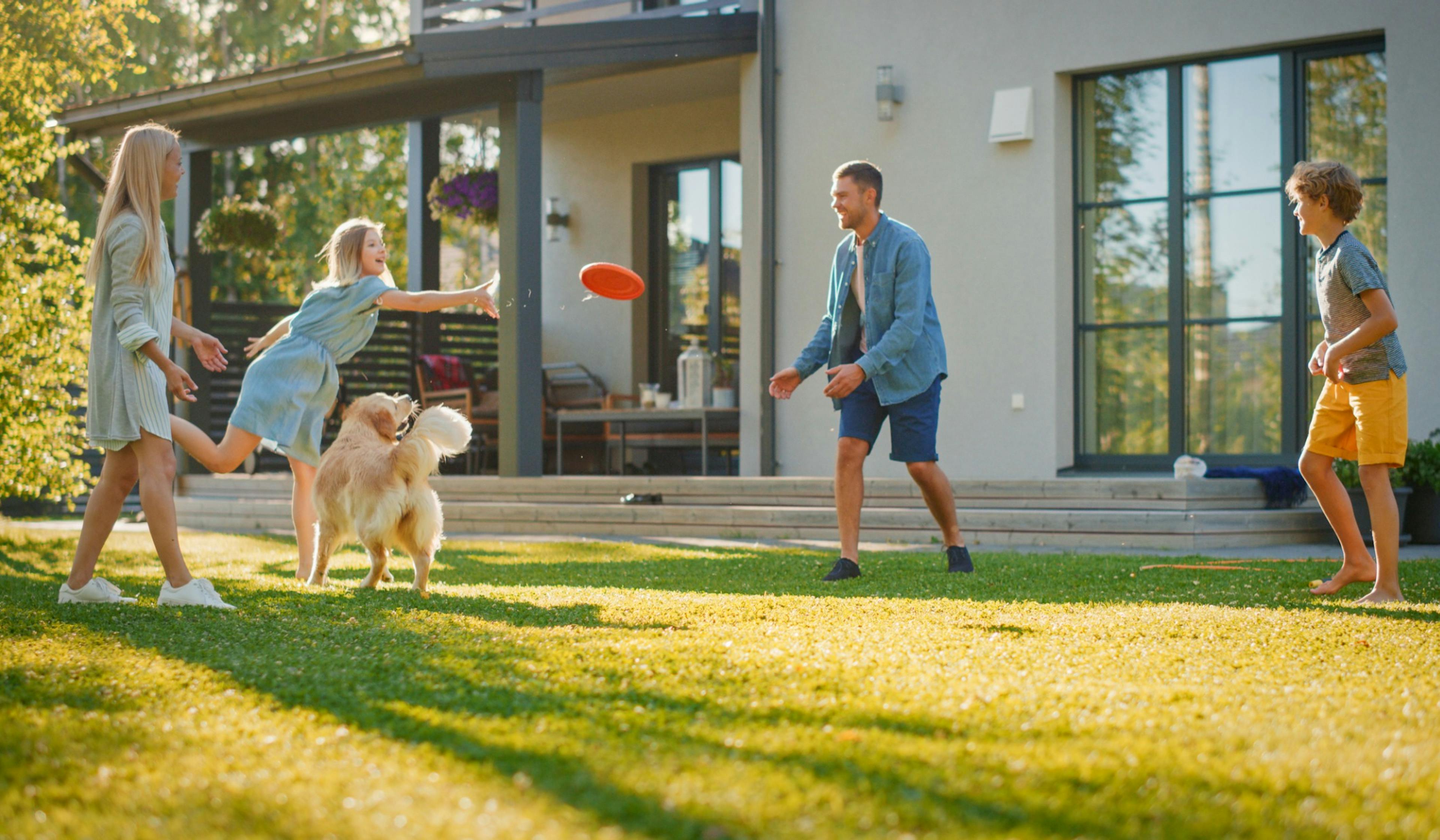 family throwing a frisbee