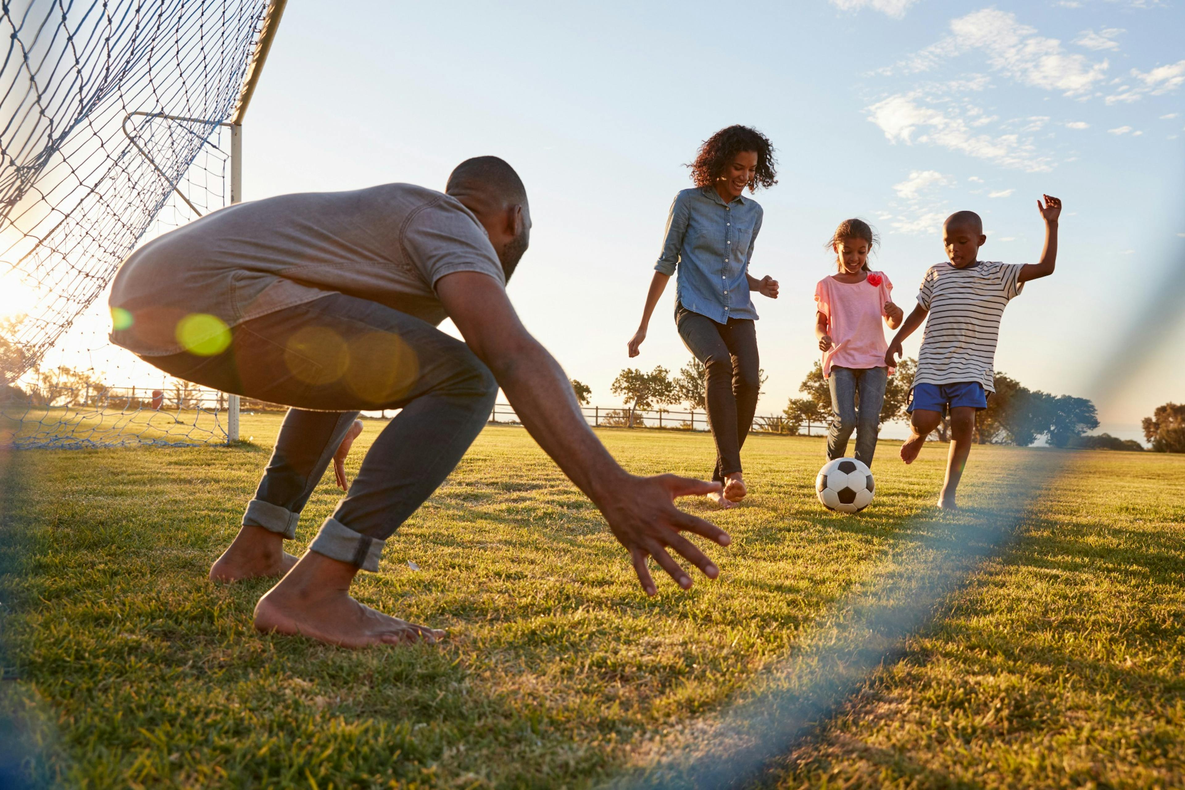 family playing soccer