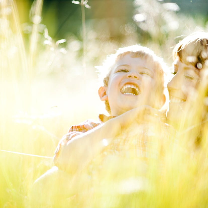 mom and son outside in the grass