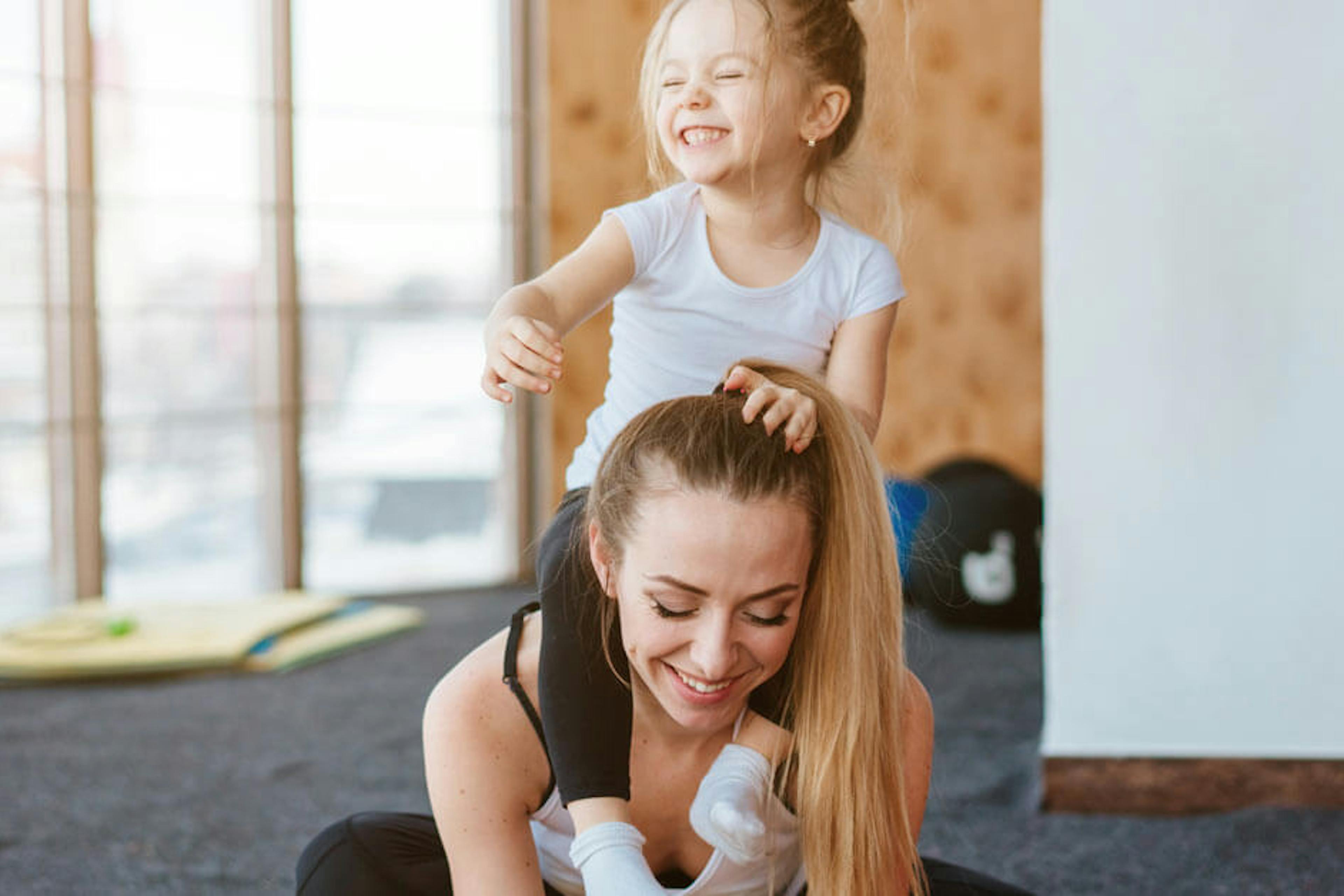 mom and daughter in a gym