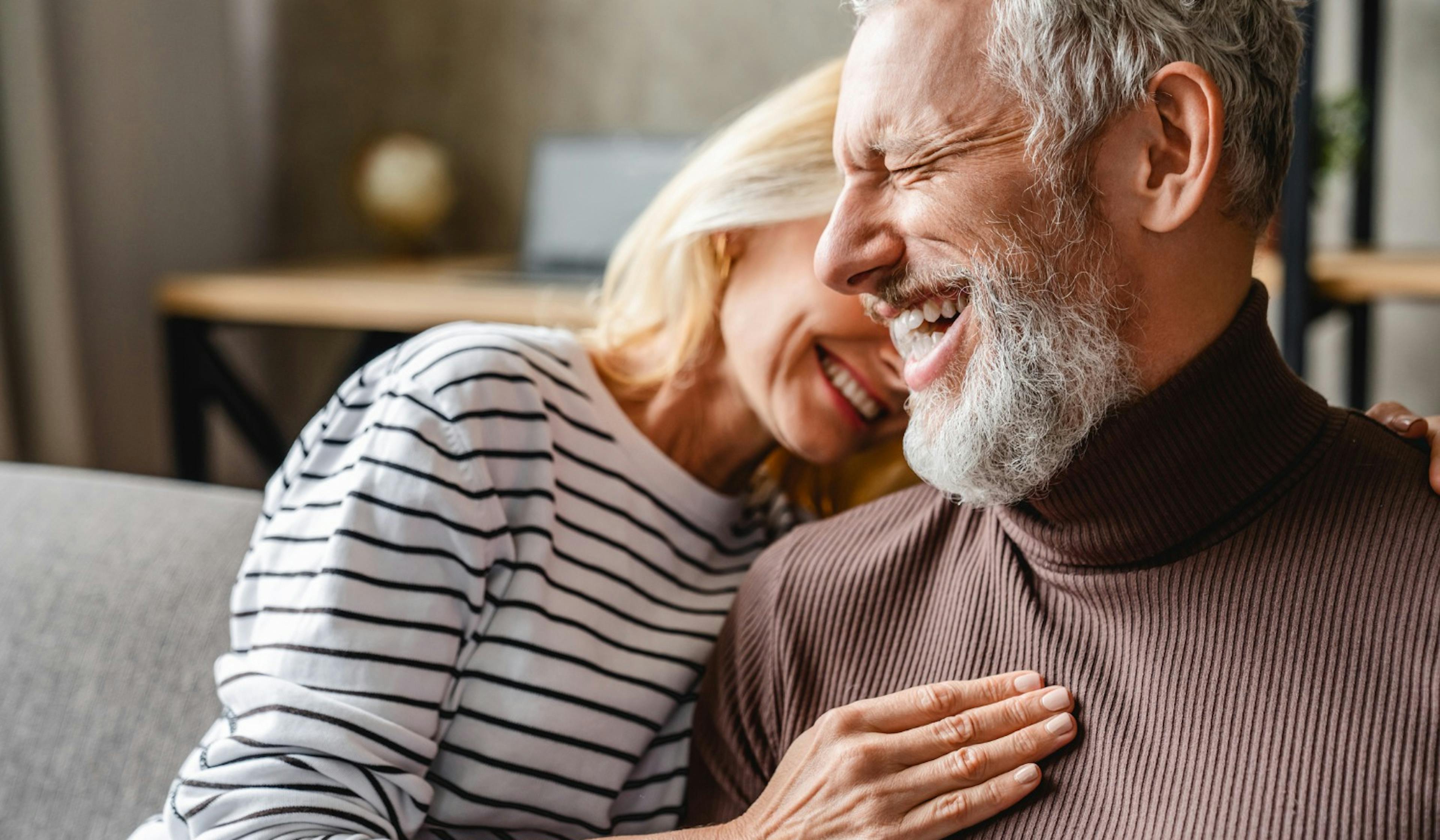 happy laughing middle age couple