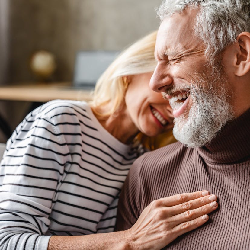 happy laughing middle age couple