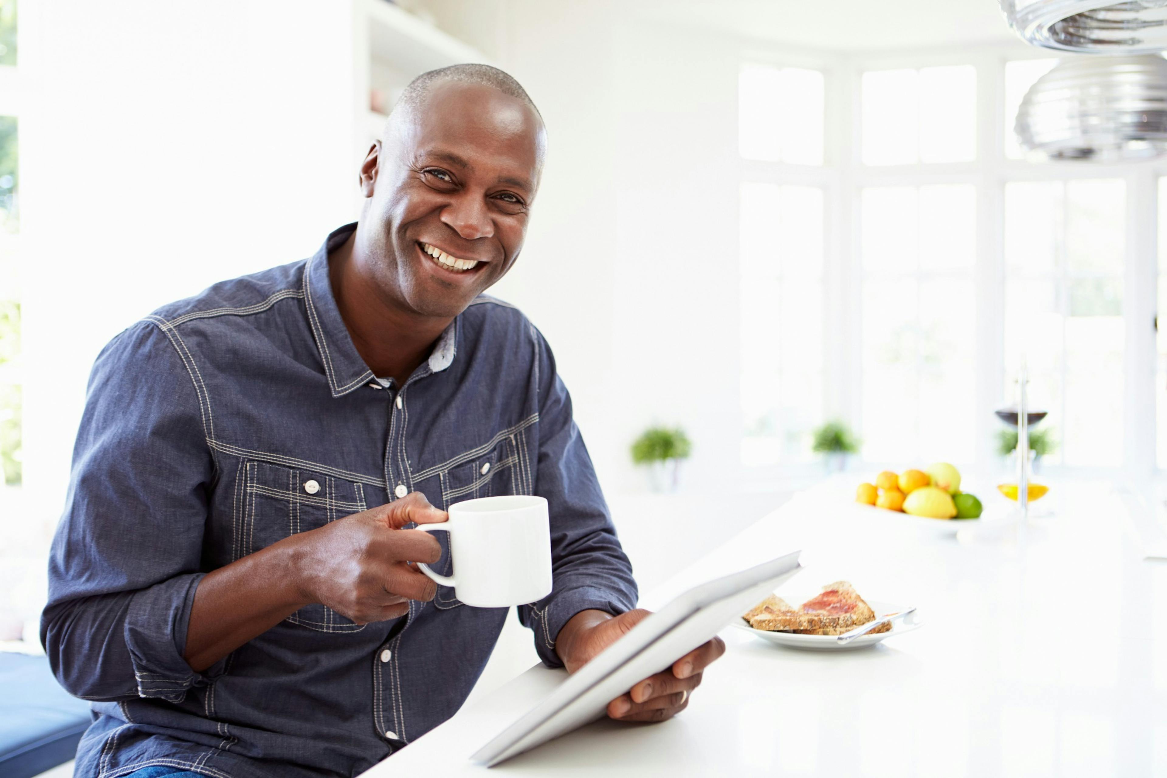 happy middle age man drinking coffee