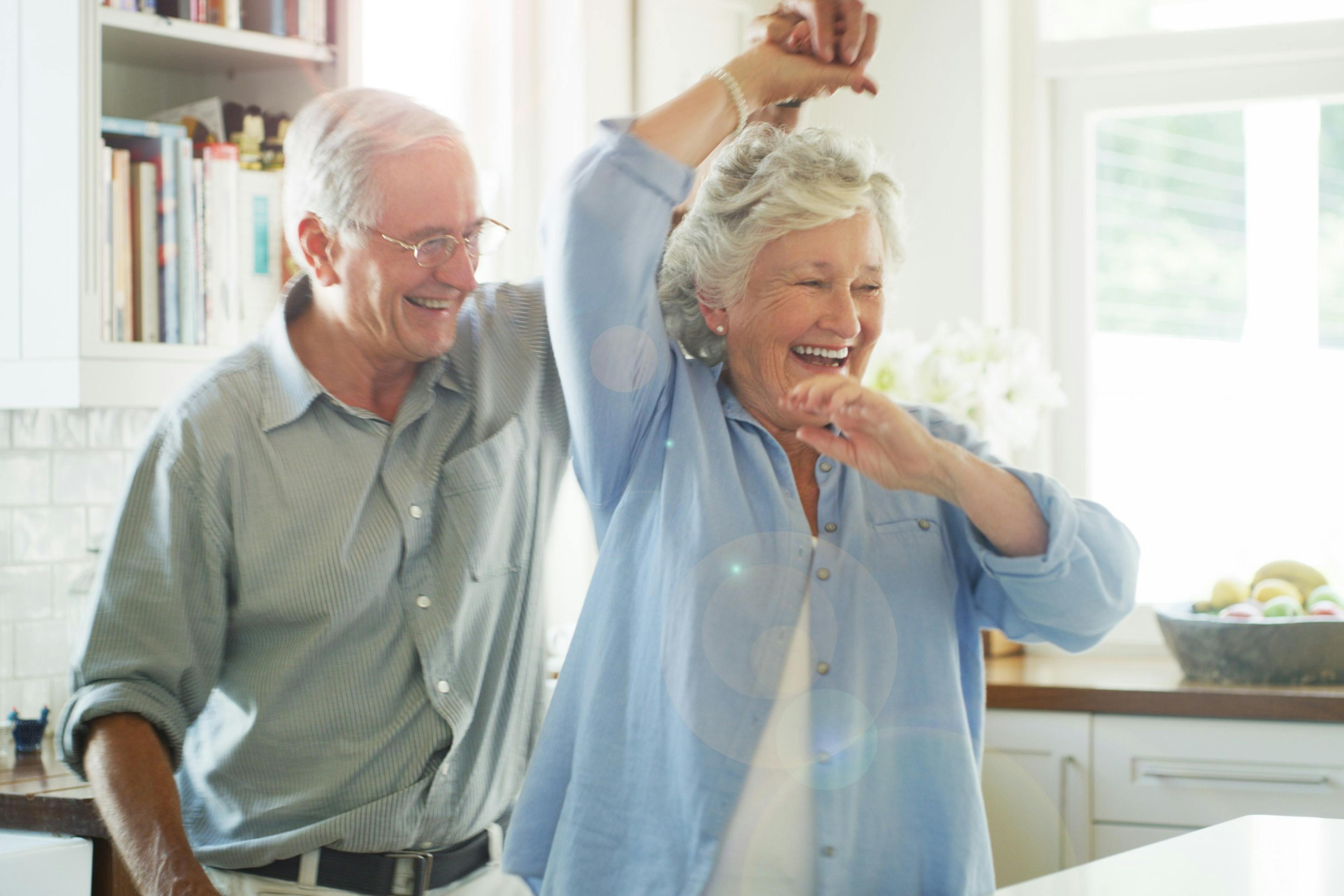 older couple dancing in the kitchen