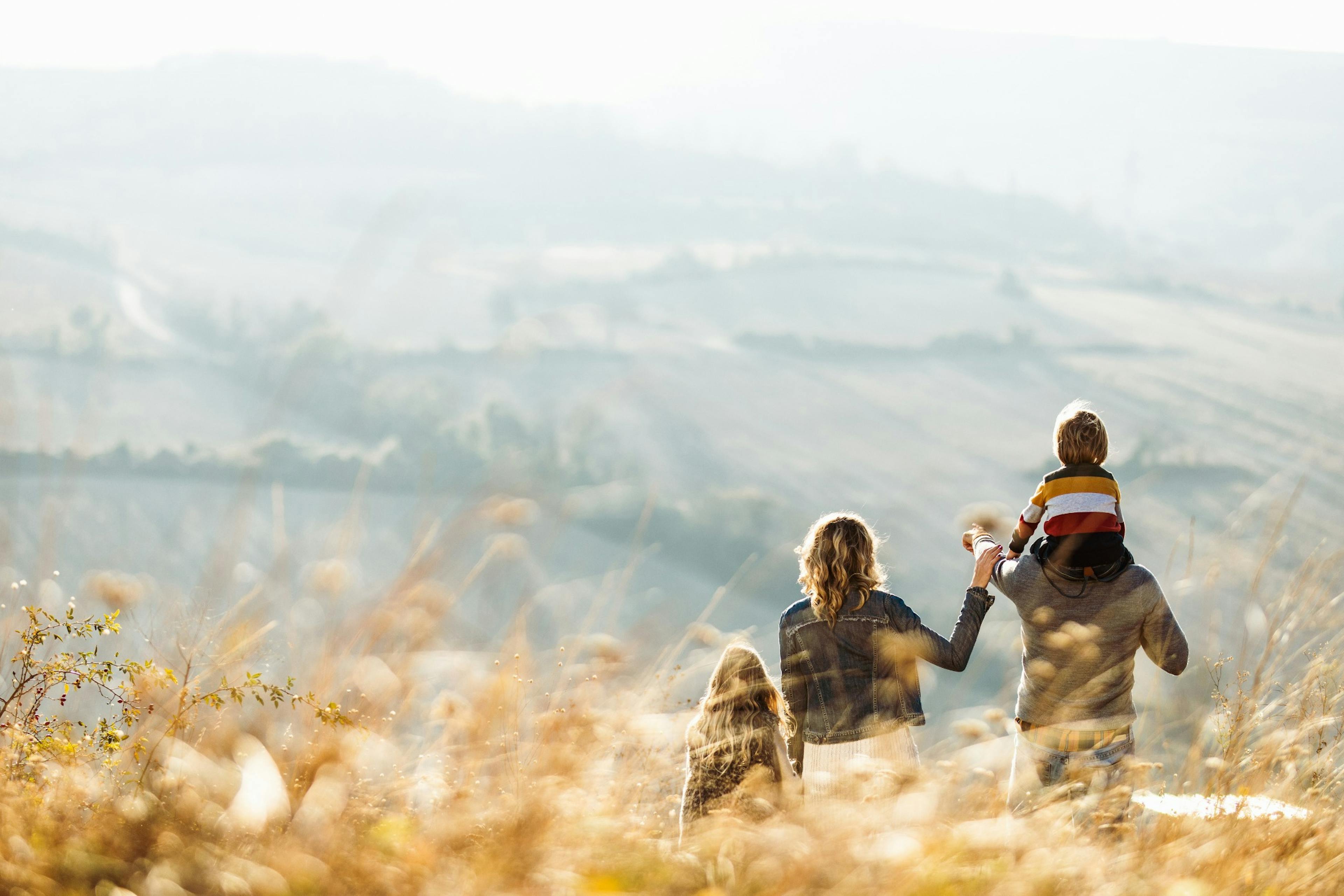 family outside on the hillside