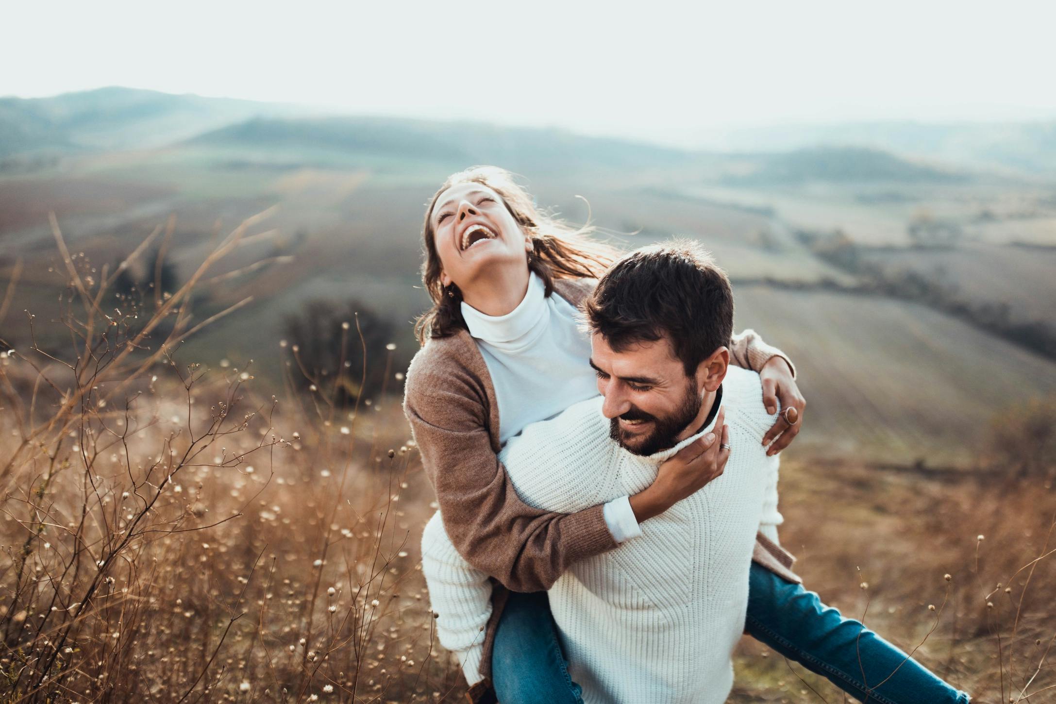 cheerful couple hiking