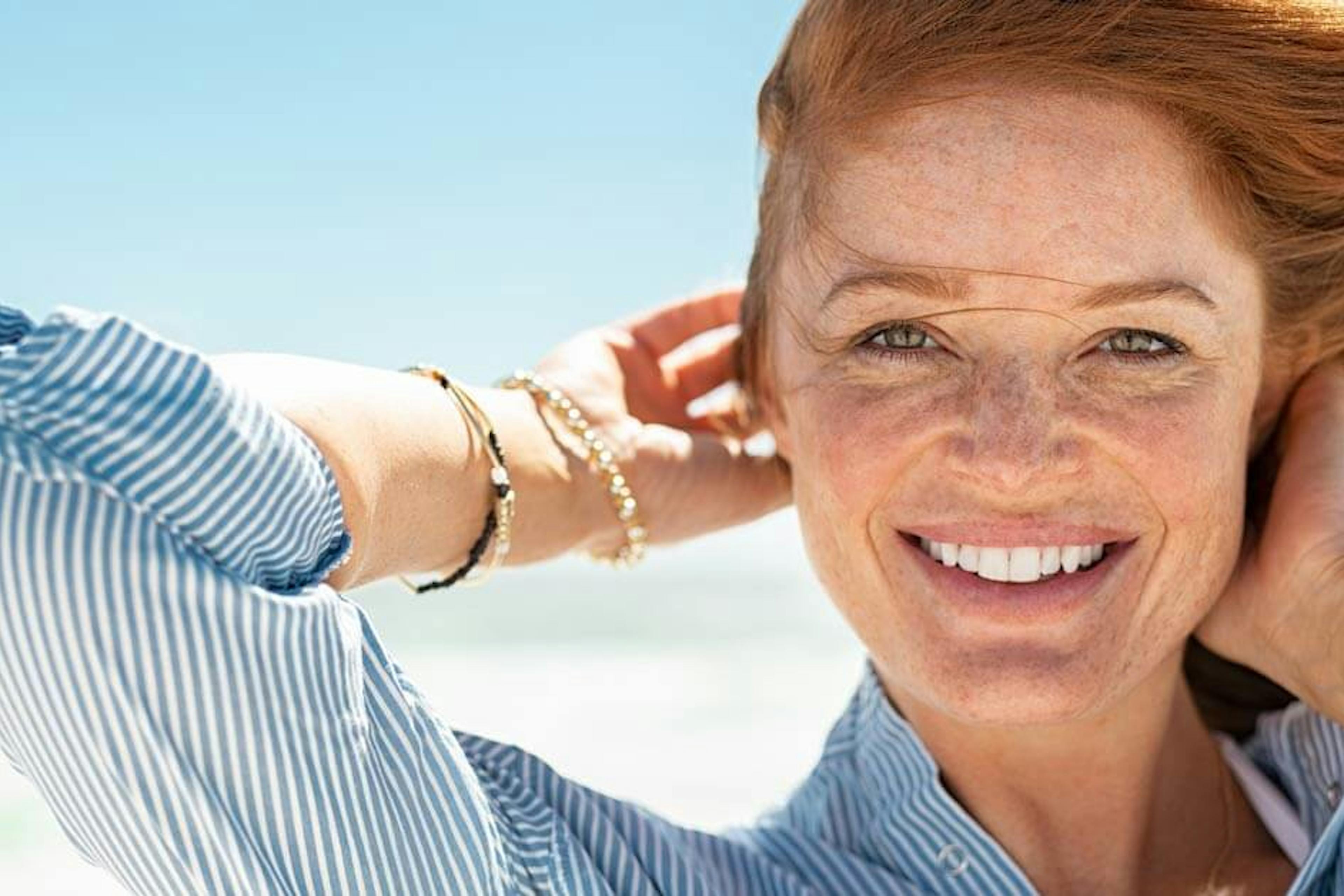 happy beautiful redhead in the sun