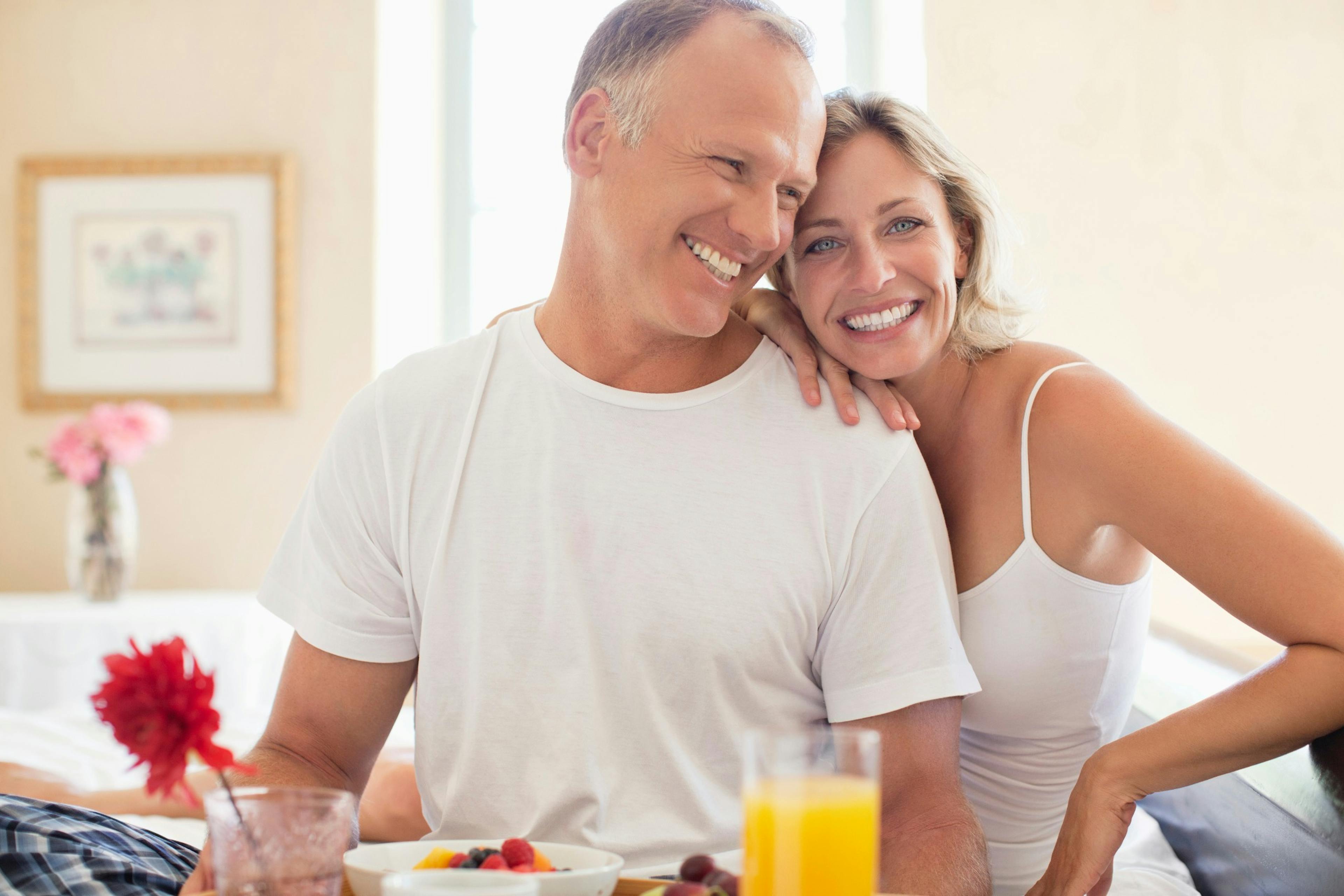 happy couple eating a healthy breakfast.