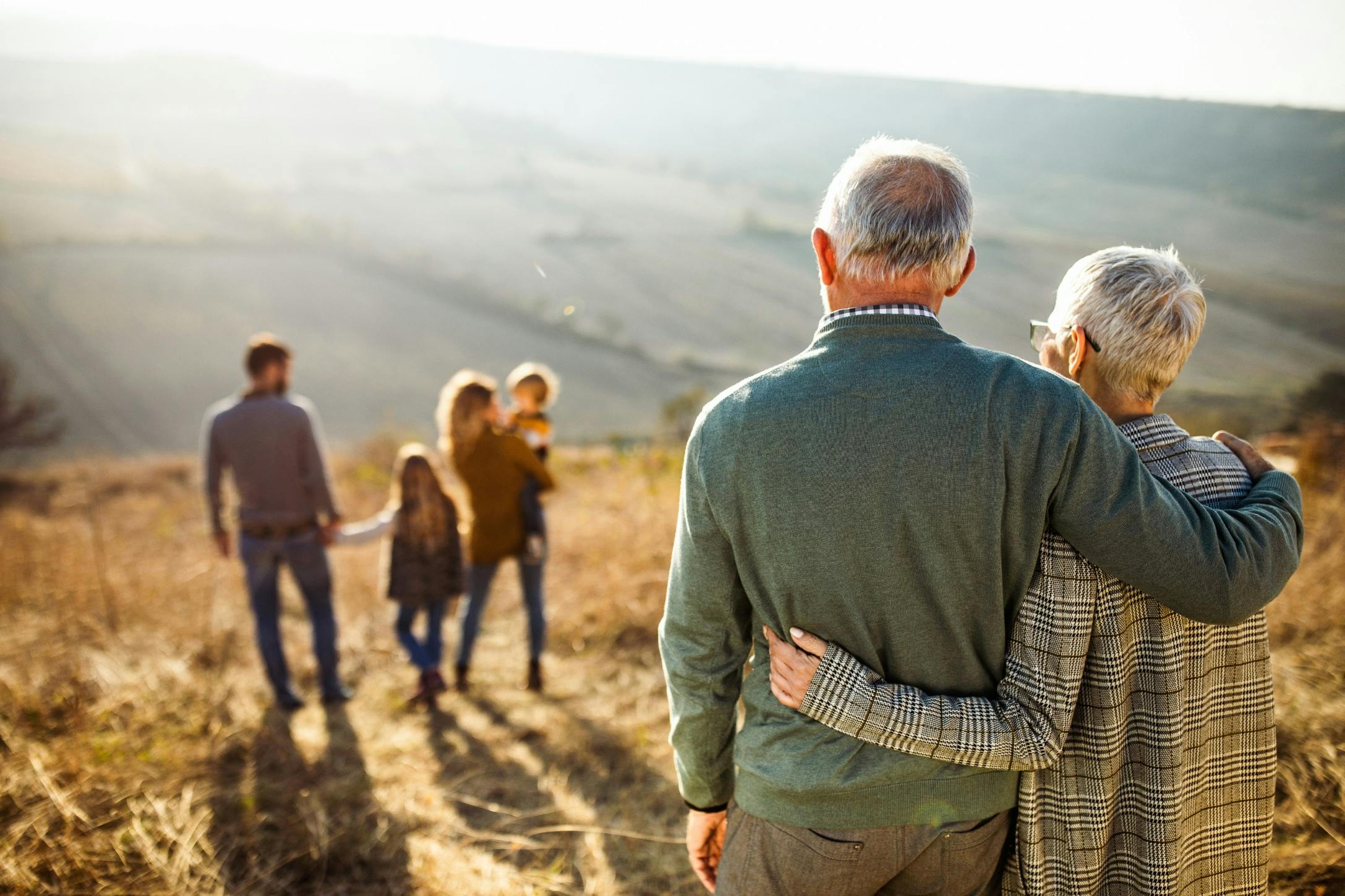 grandparents watching their kids and grandchildren