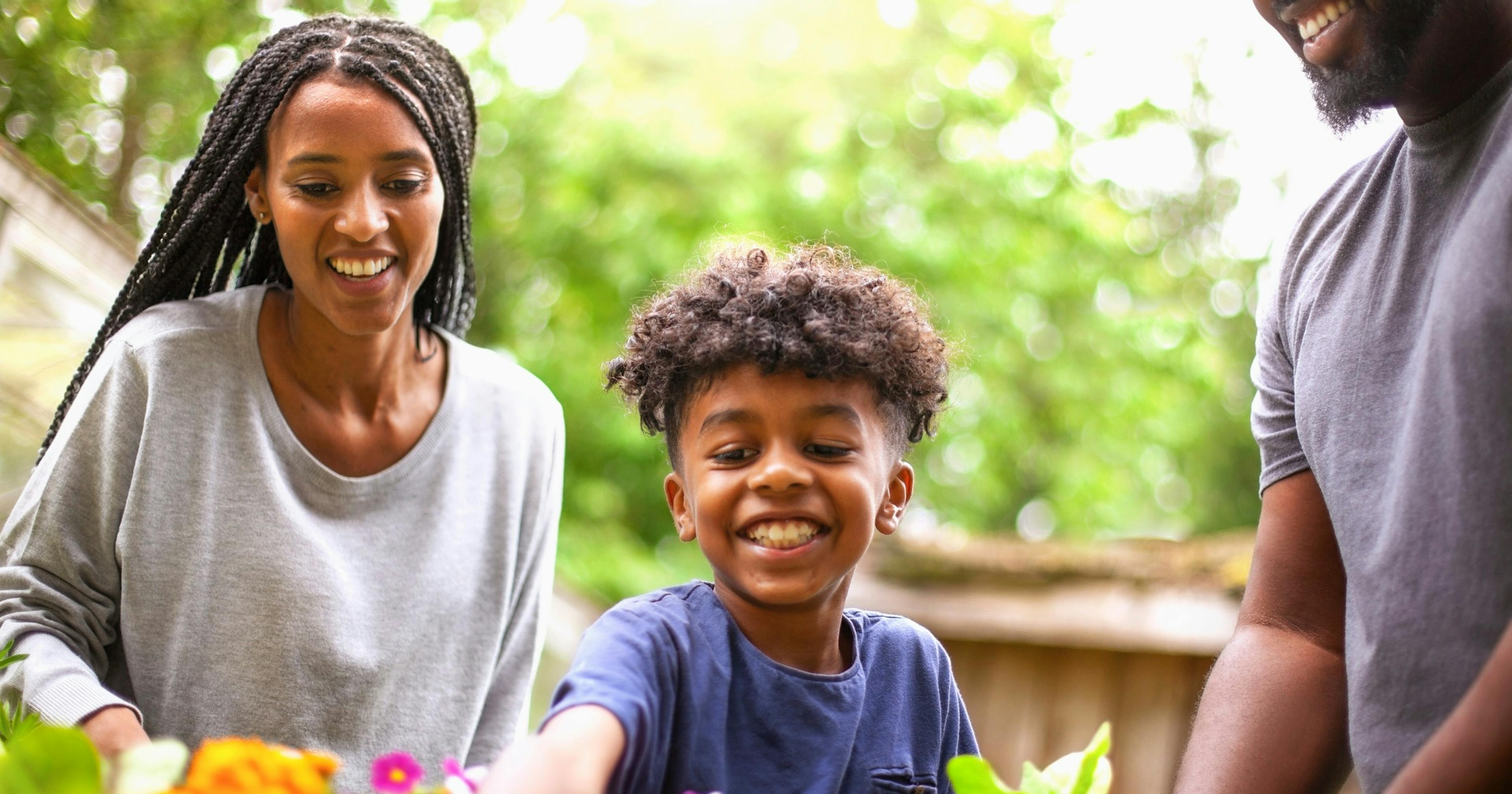 young family gardening