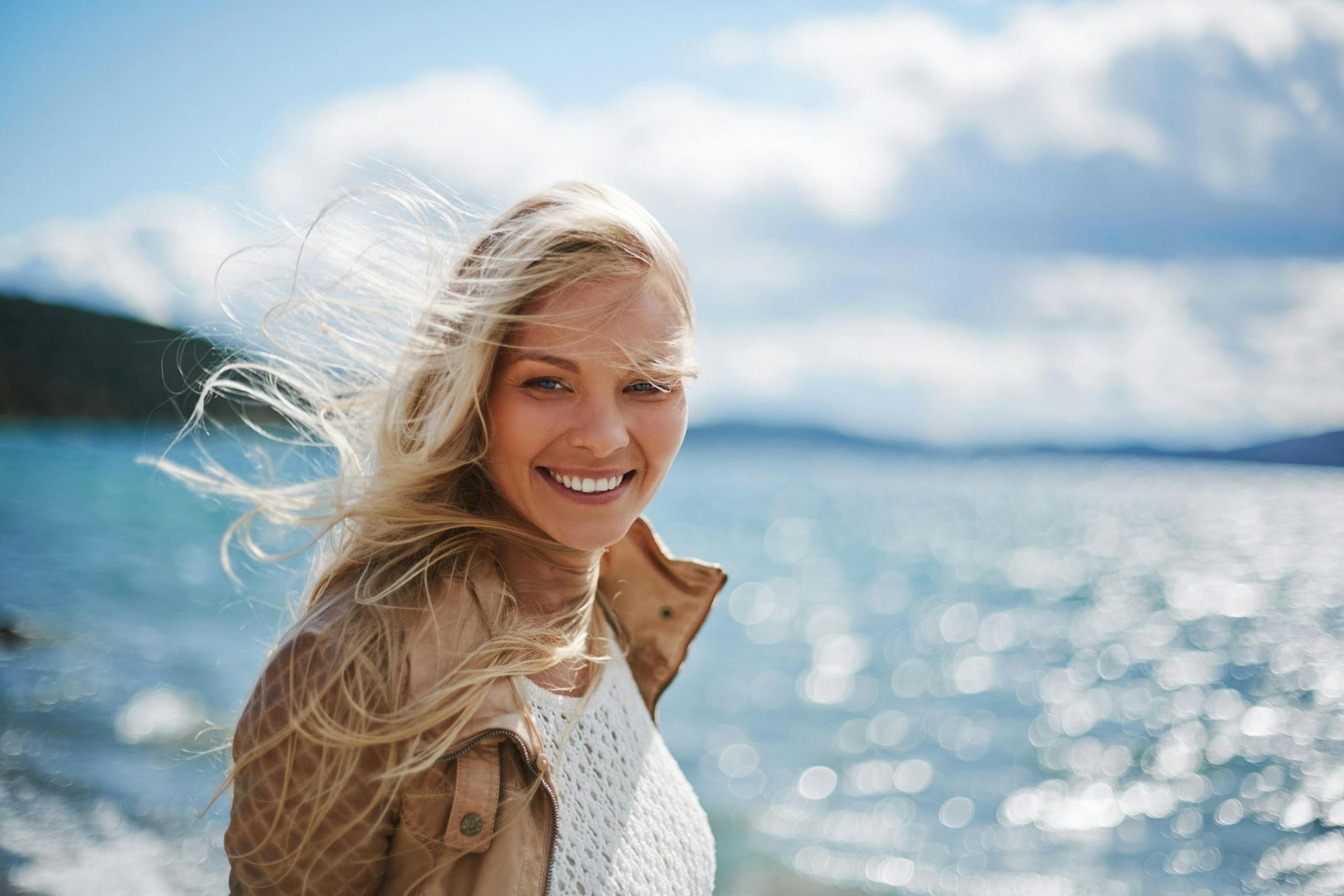 blond woman by the ocean