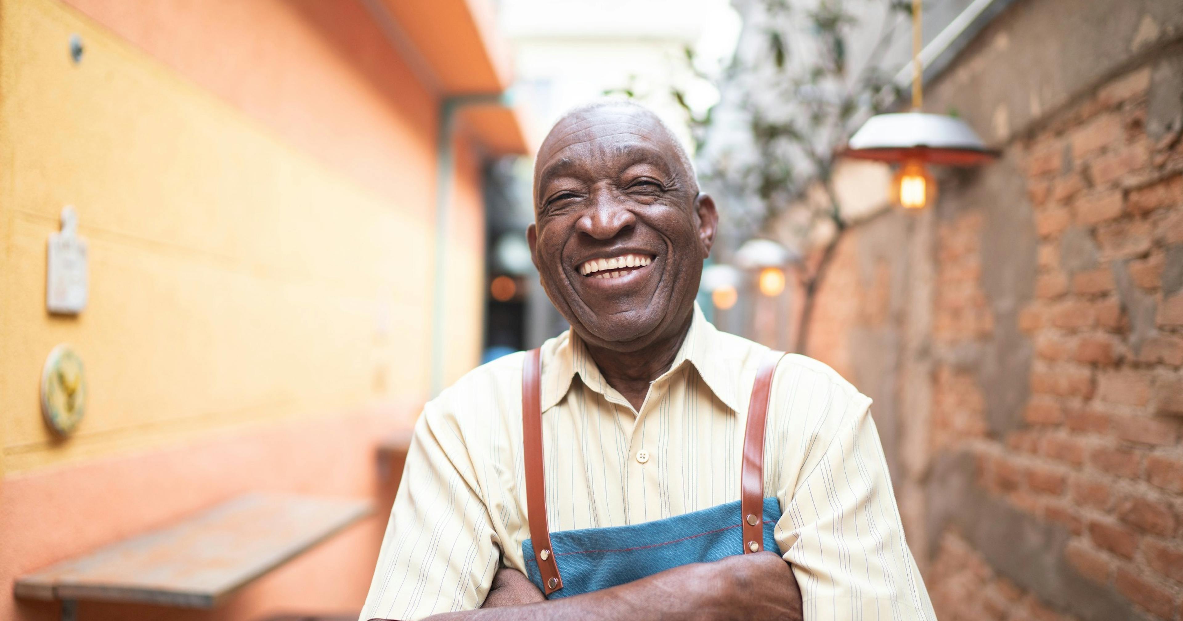 smiling man outside in work clothes