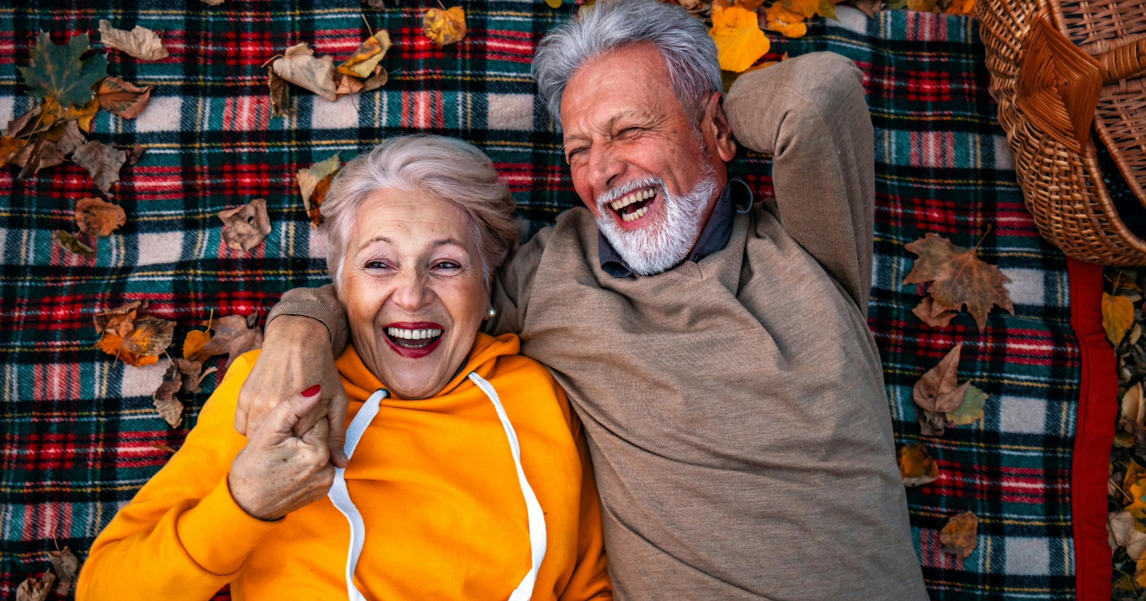 older healthy couple outside relaxing