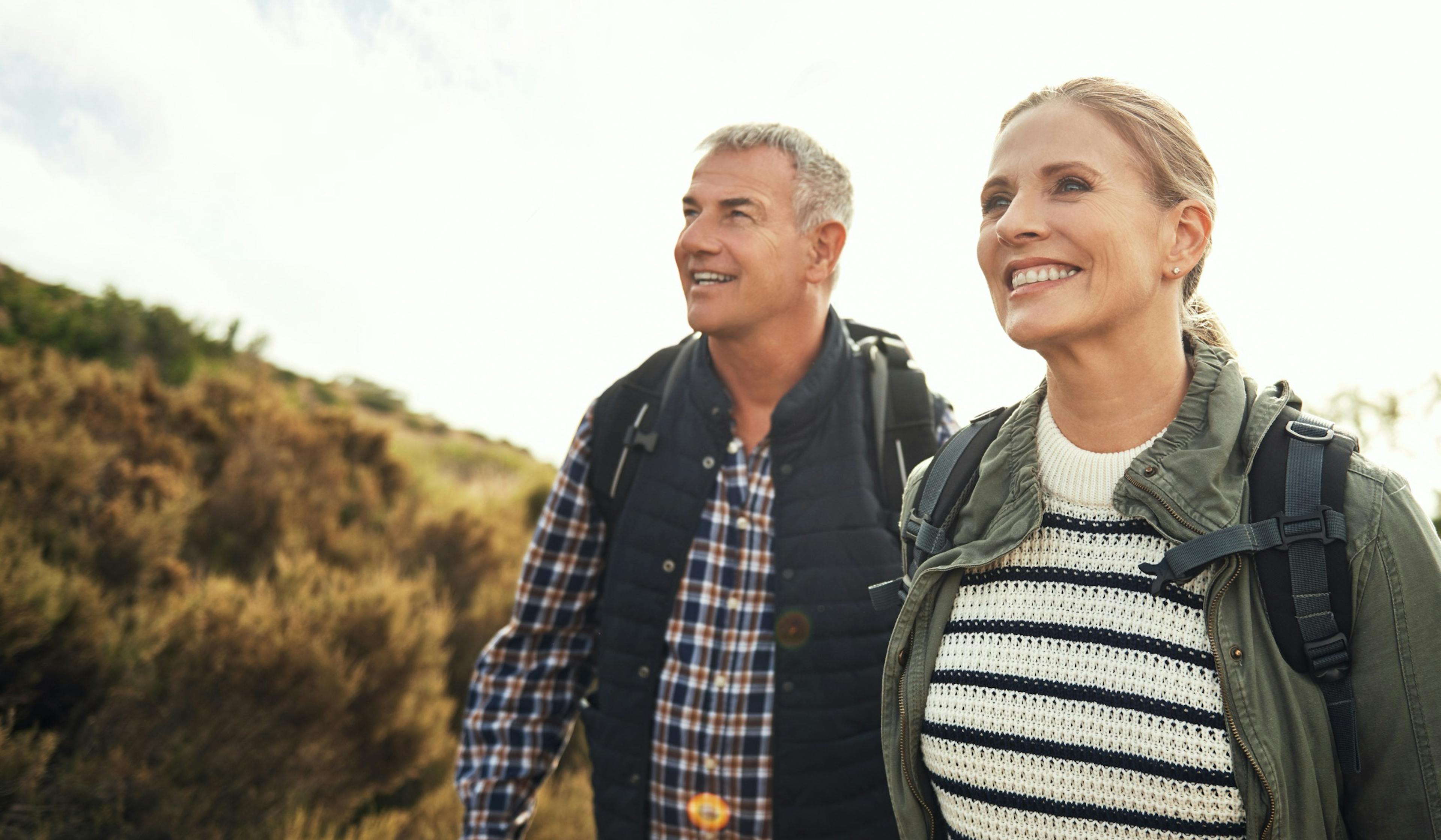 healthy middle aged couple out hiking