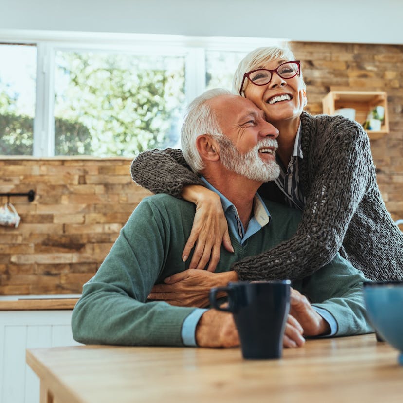 happy older couple in kitchen