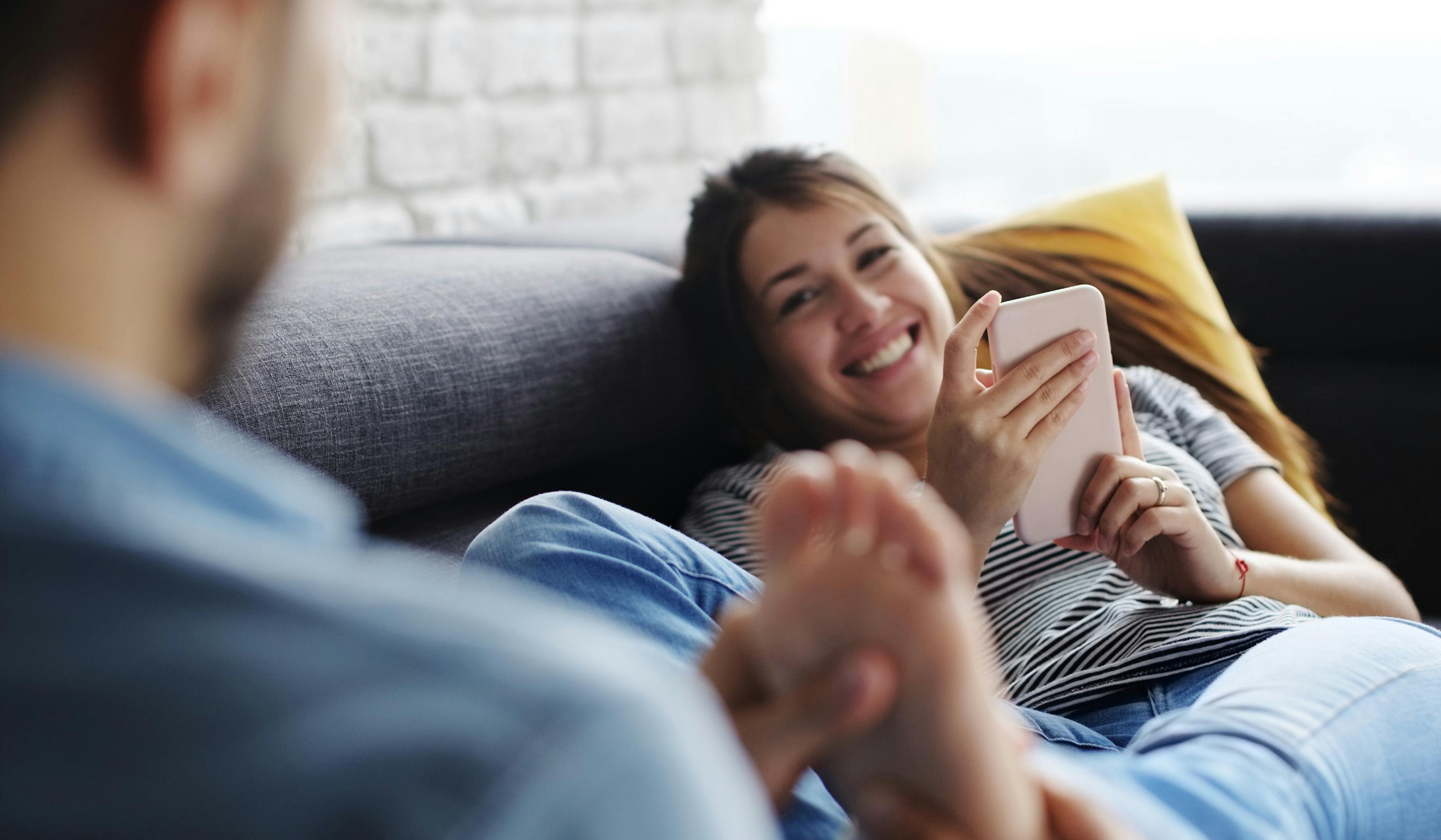 man massaging wife's feet