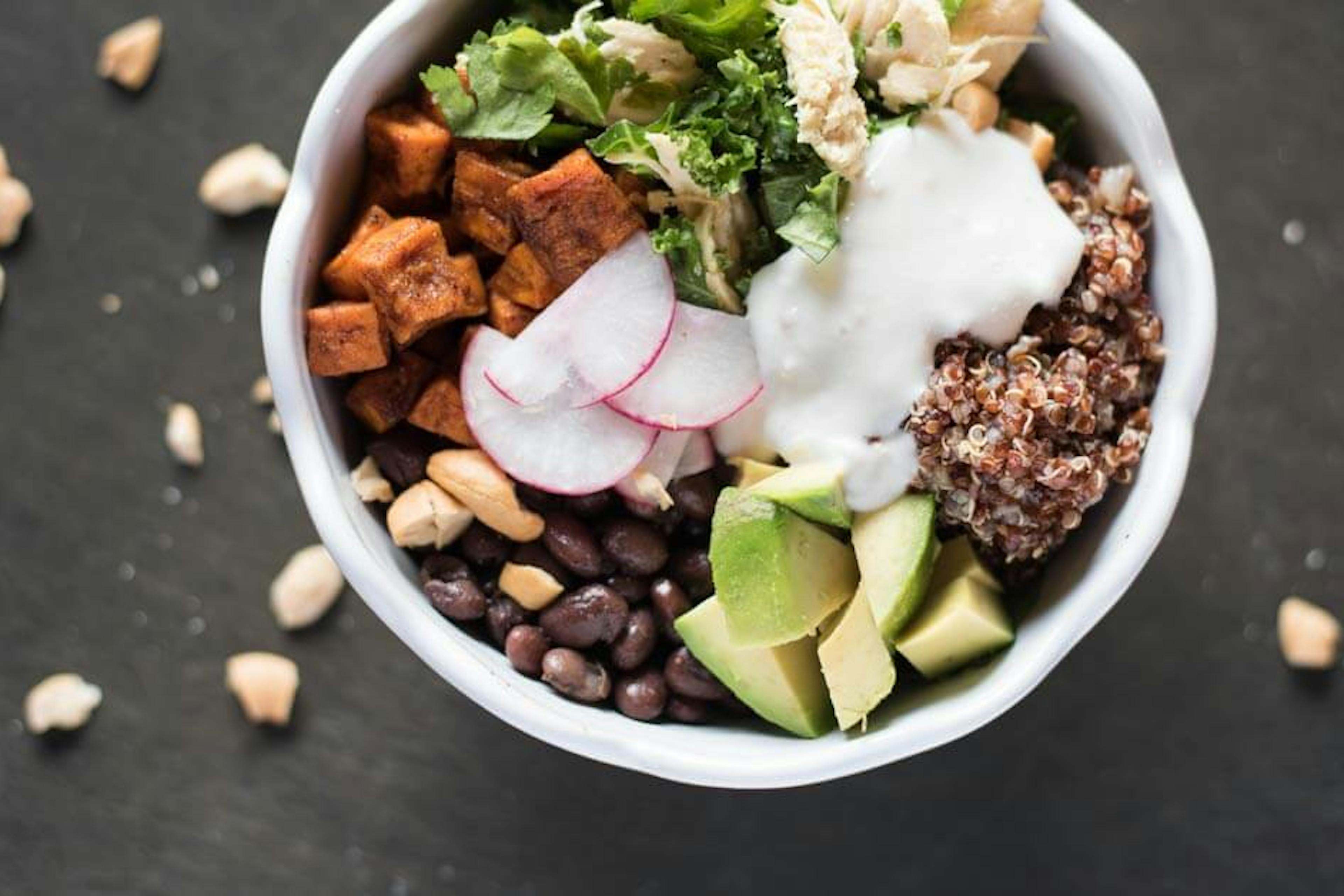 Cuban Kale Quinoa Bowl with avocados, black beans, and avocado.