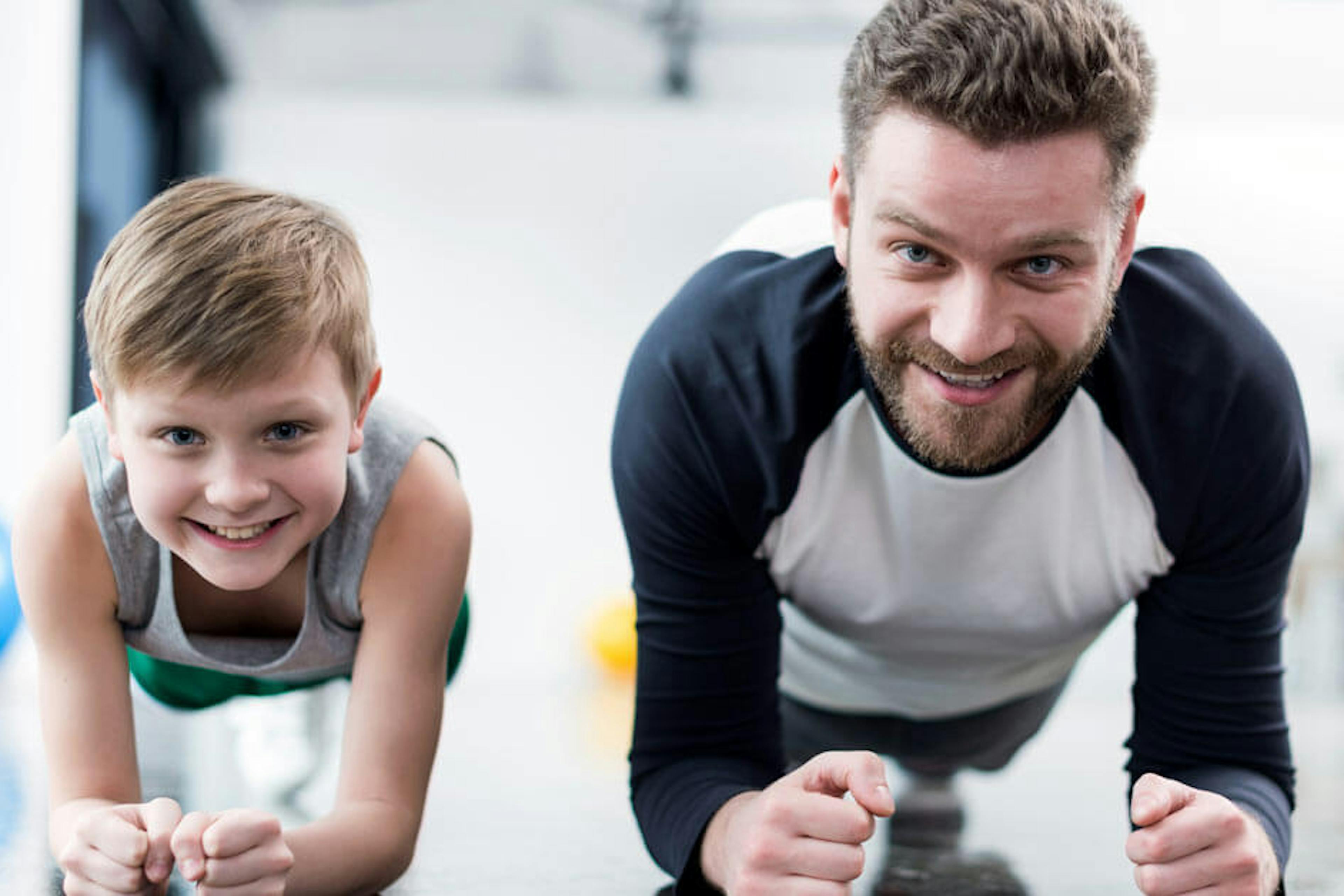 Father and son working out together.