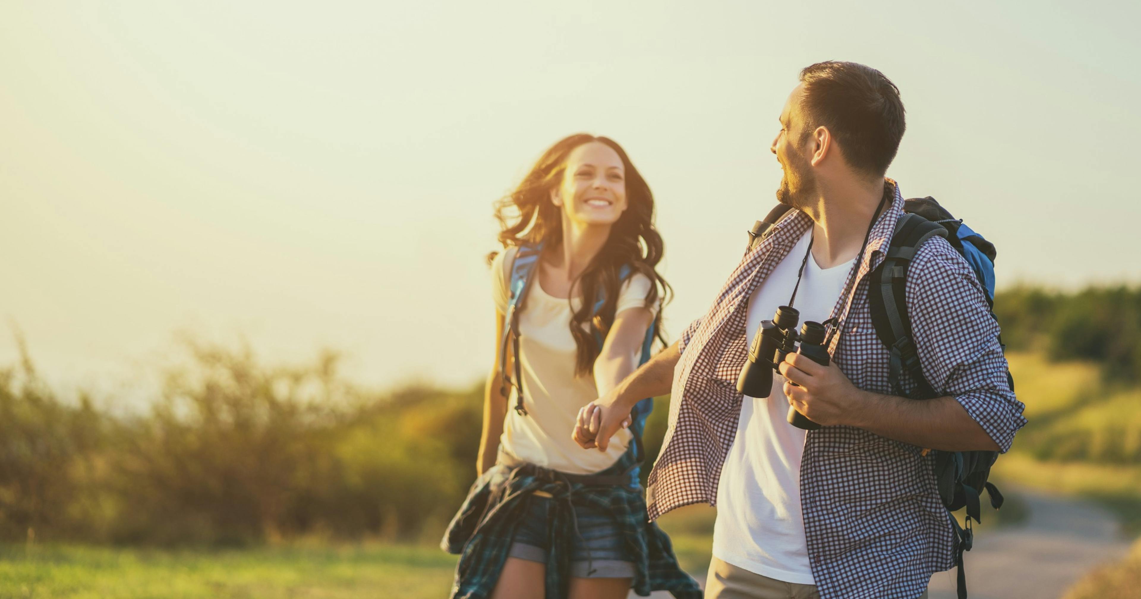 happy couple outside on a hike