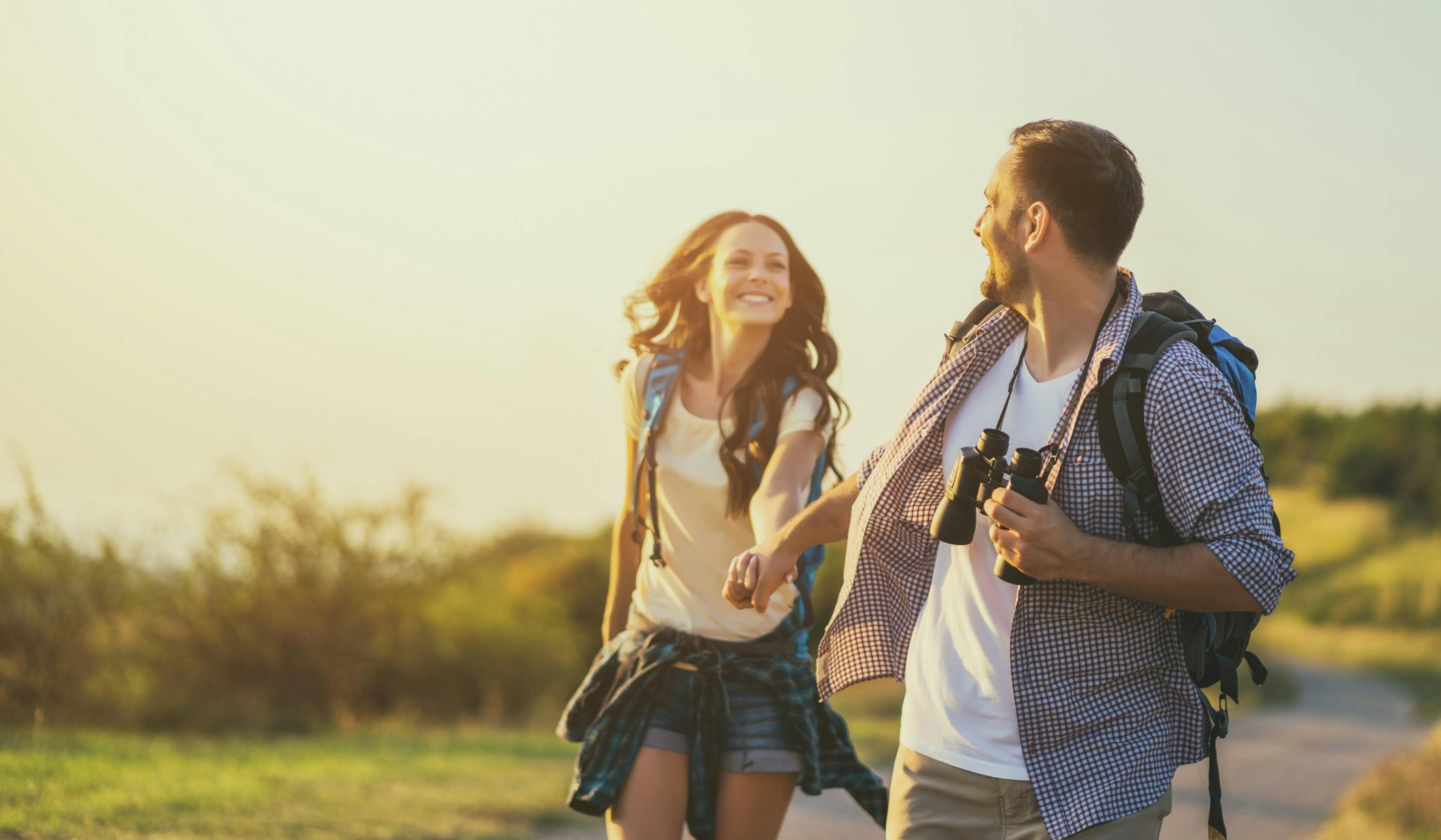 happy couple outside on a hike