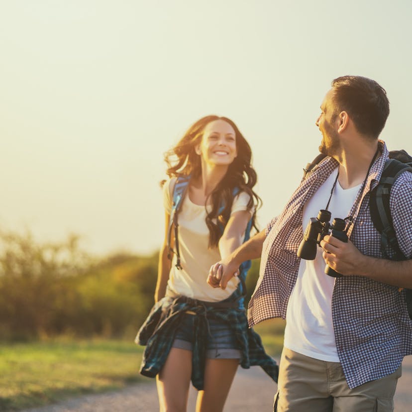 happy couple outside on a hike