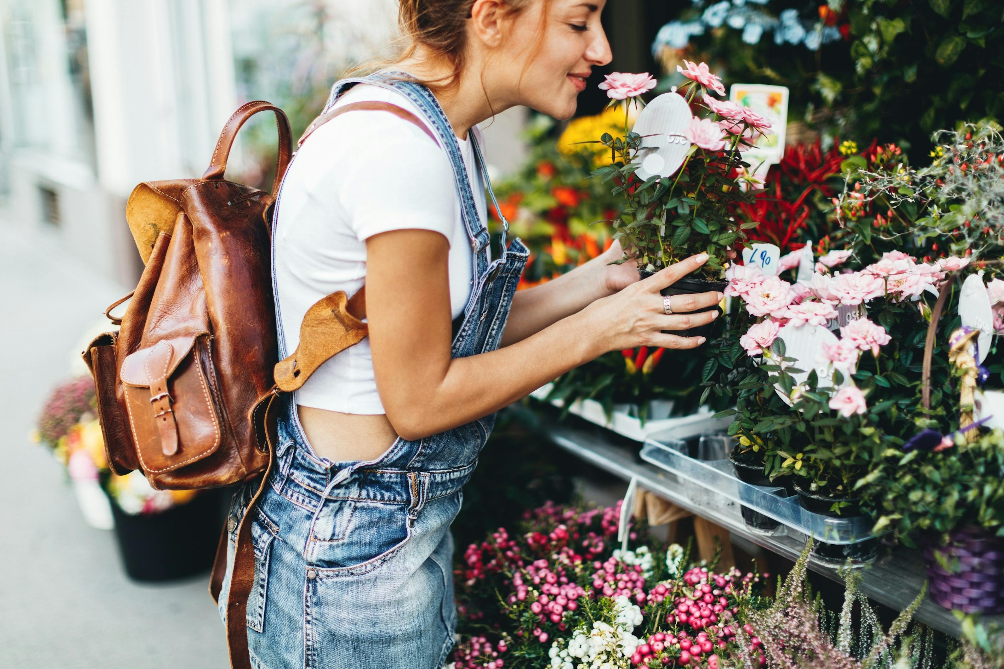 young woman buying flowers