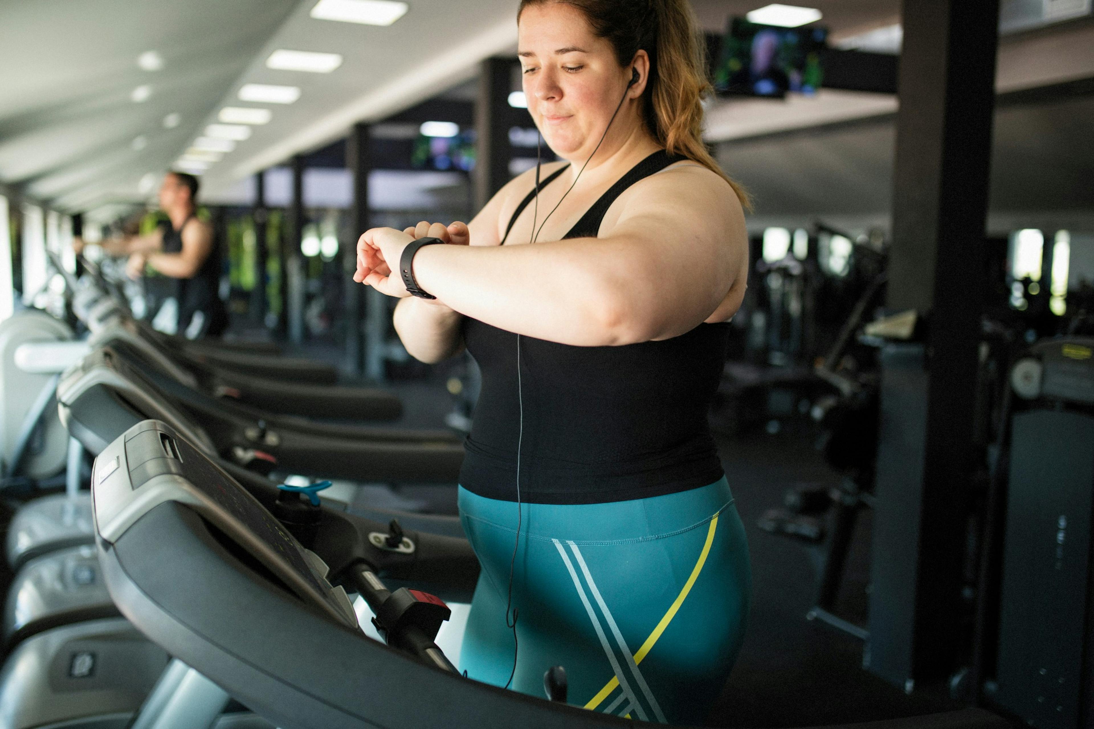 An overweight woman at the gym