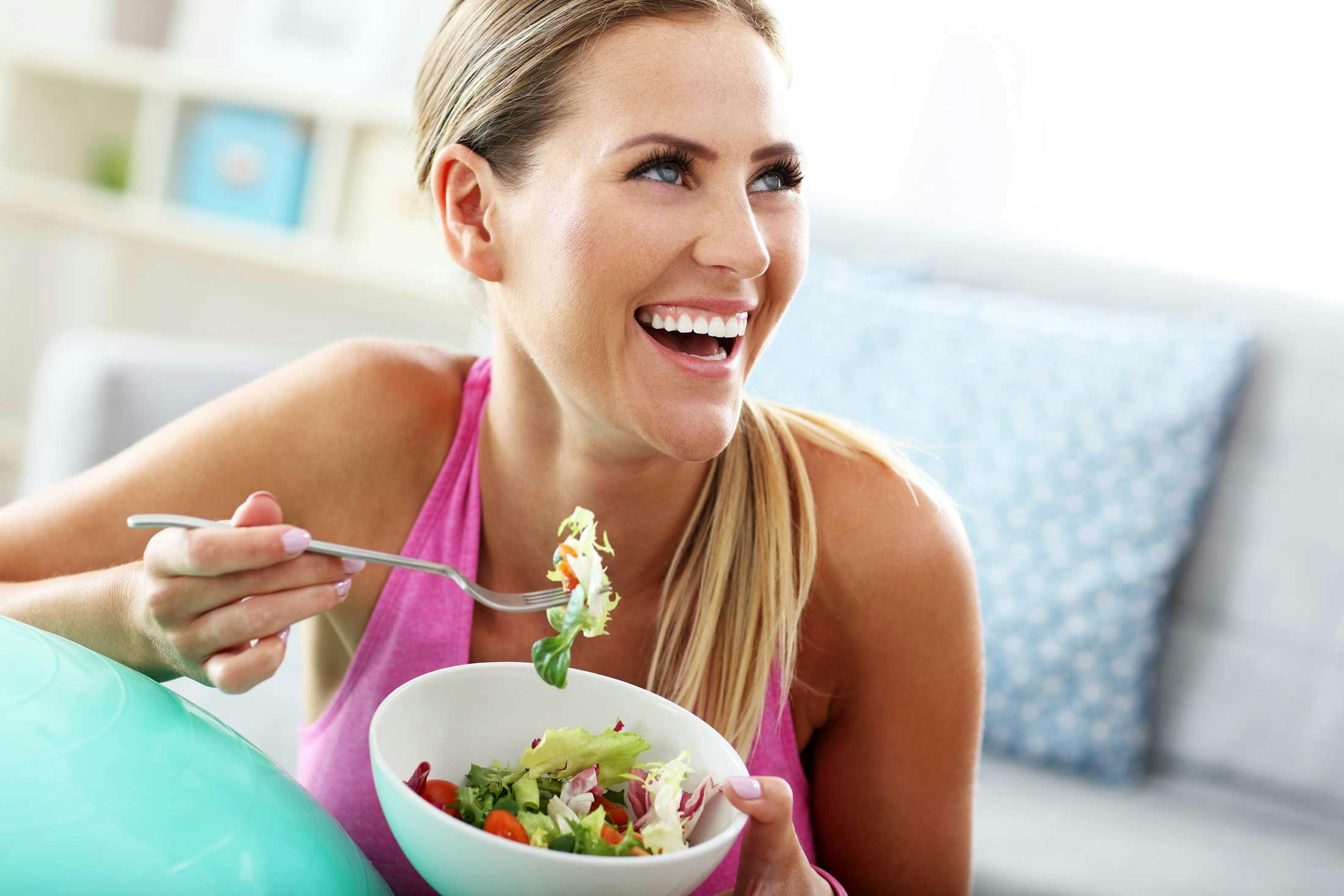 Woman eating salad