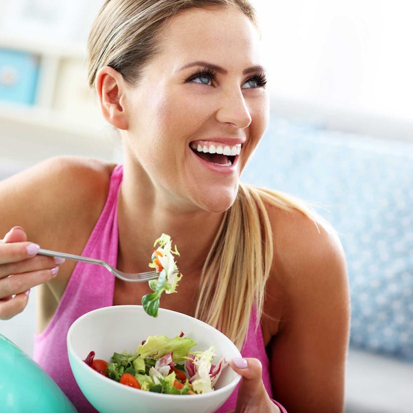 Woman eating salad